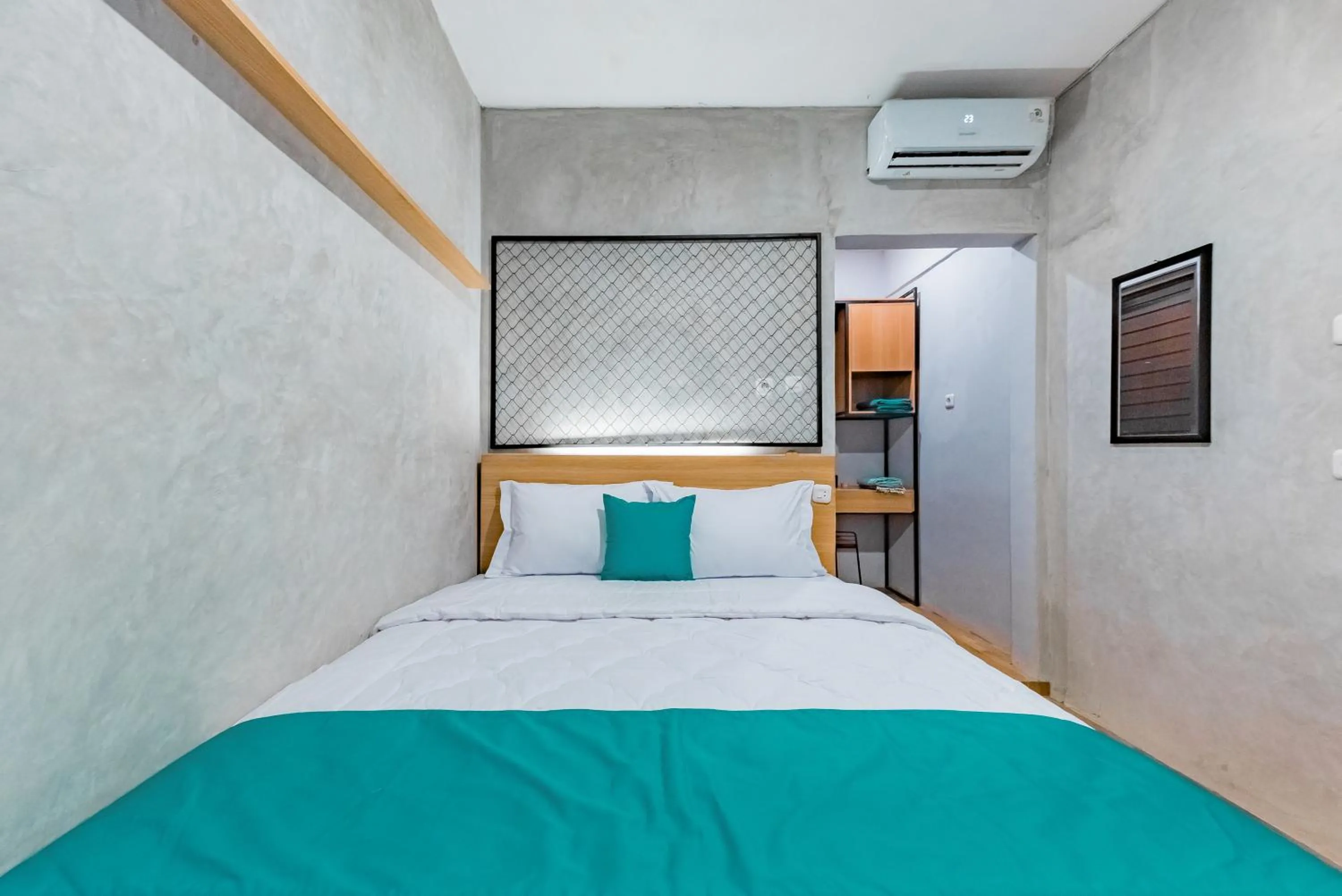 Bed in Ultima Guest House