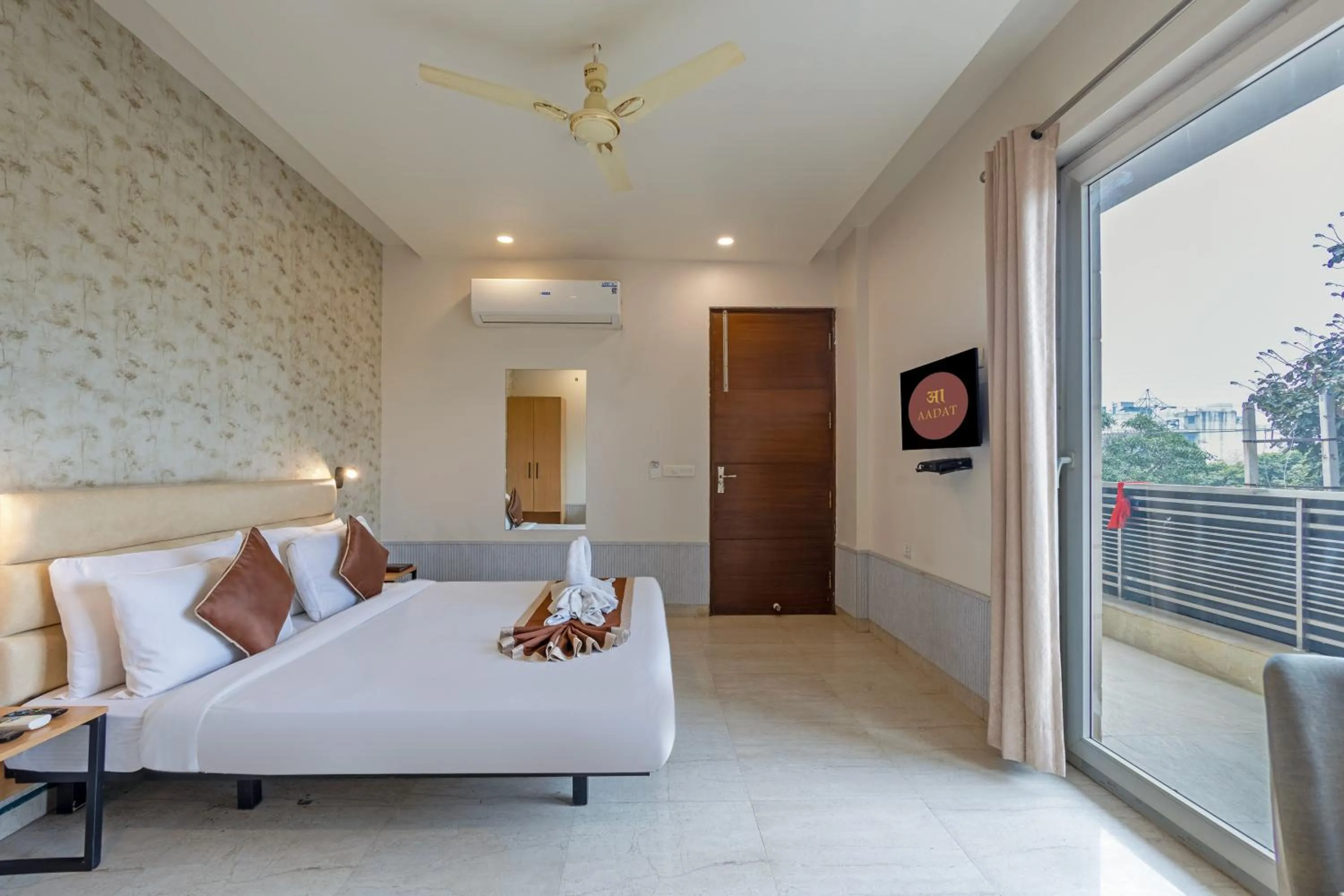 Bed in Aadat Hotel Subhash Chowk Gurgaon