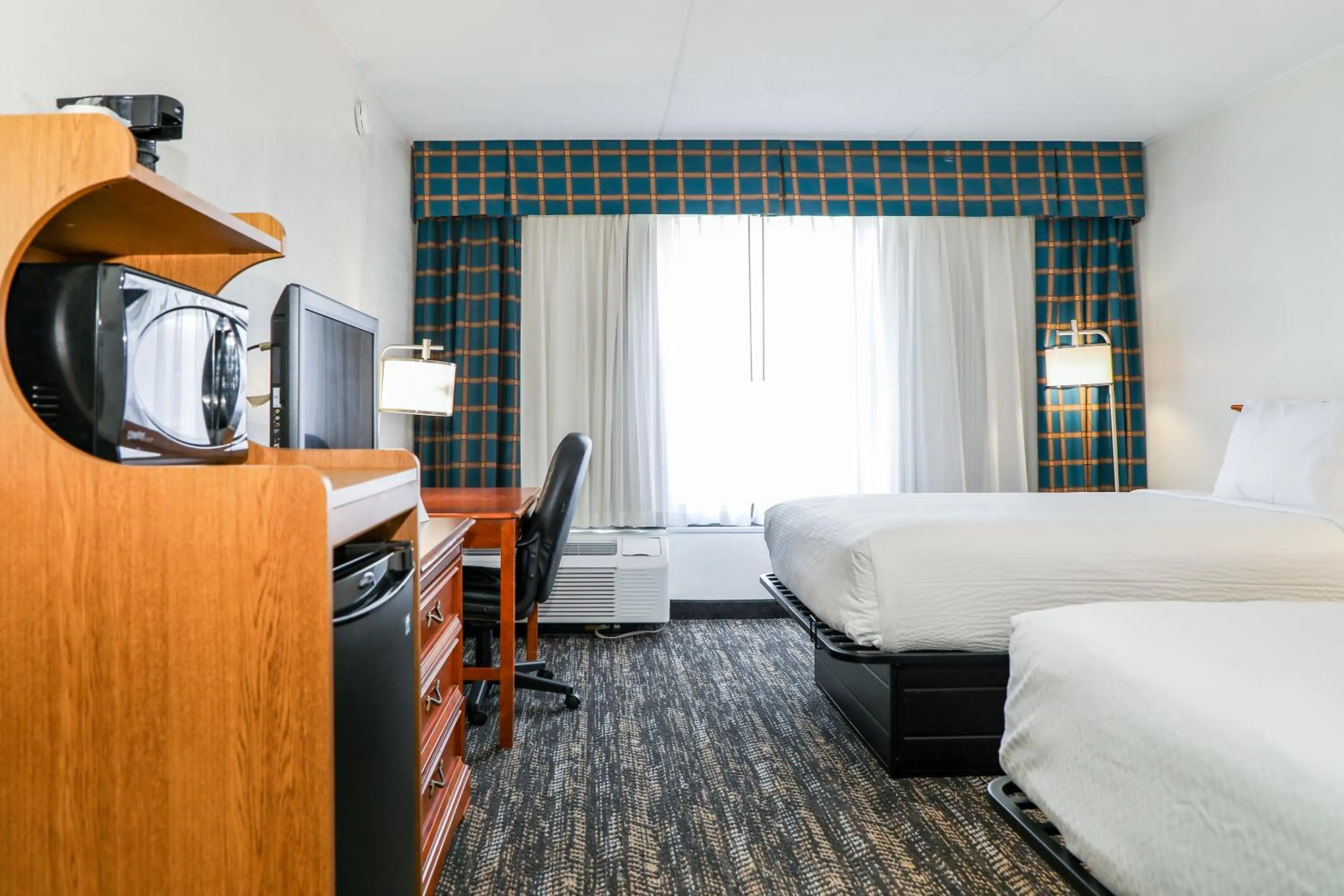 Photo of the whole room, Bed in Ramada by Wyndham Cumberland Downtown