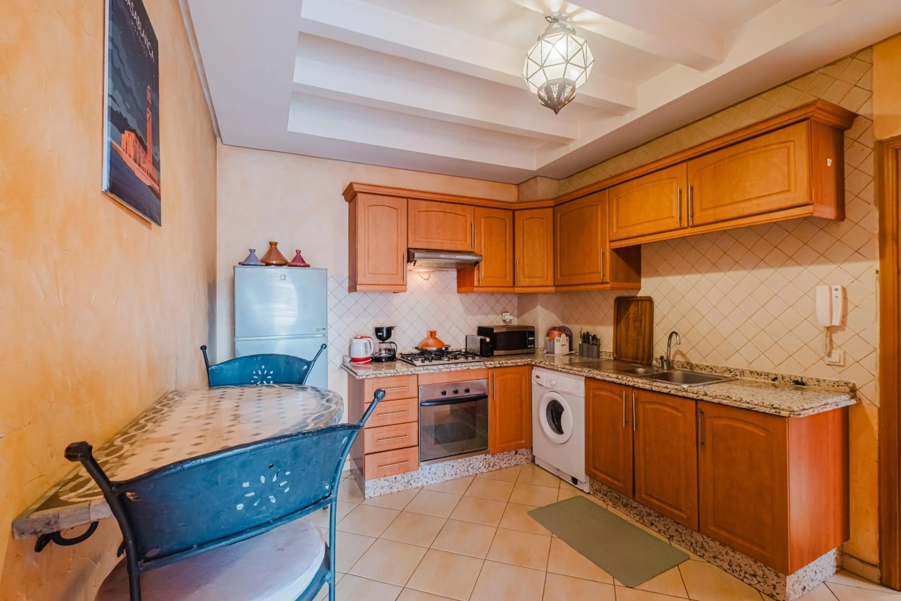 kitchen in Amoud Apartments - Stylish Comfort at Residence Dyar Al Kheir