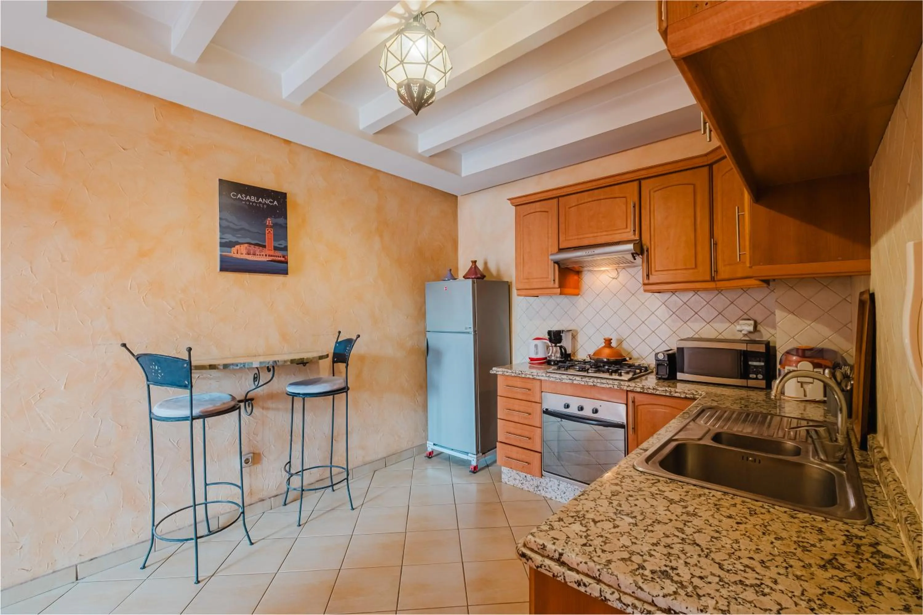 kitchen in Amoud Apartments - Stylish Comfort at Residence Dyar Al Kheir
