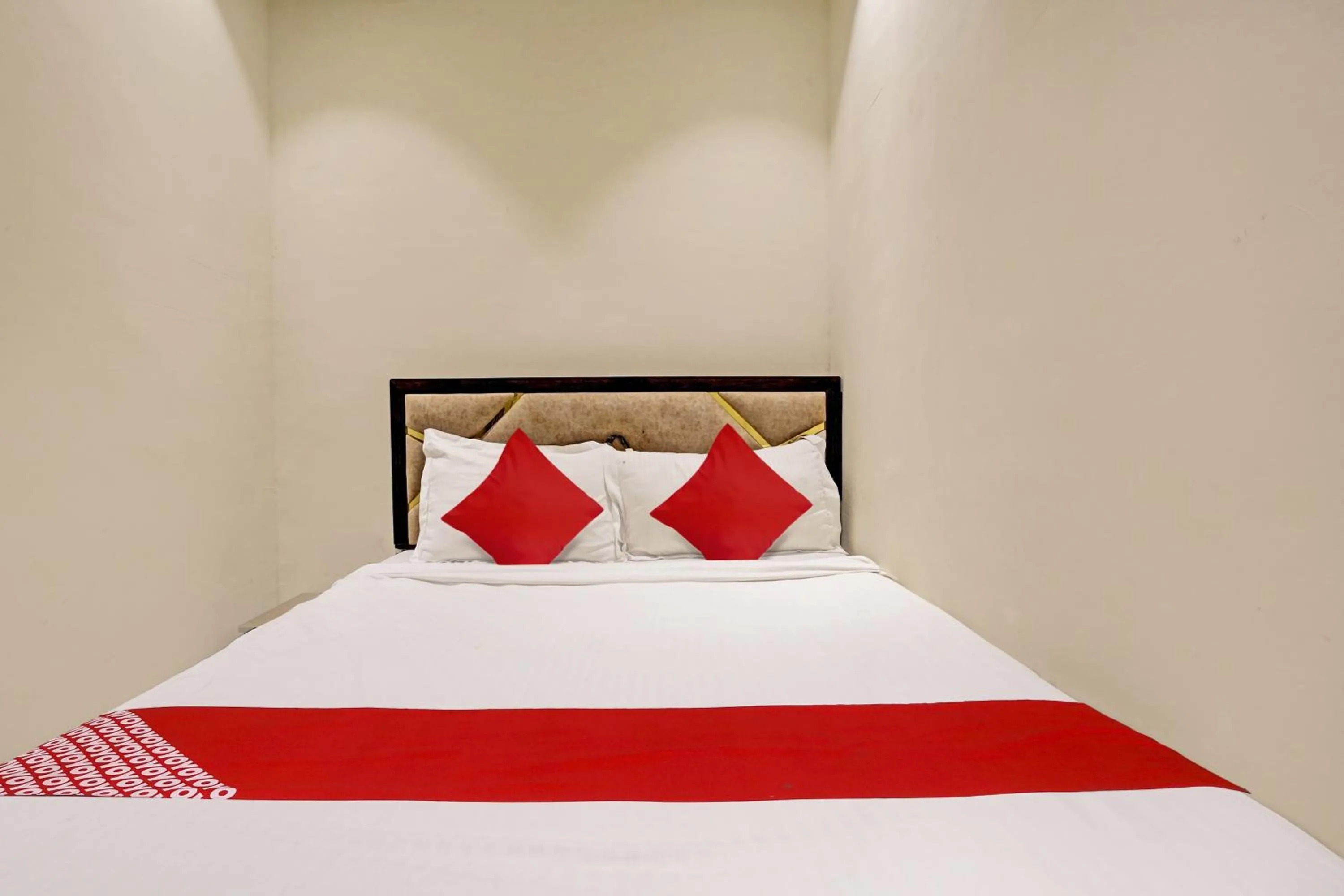 Bedroom in Hotel O NK Grand