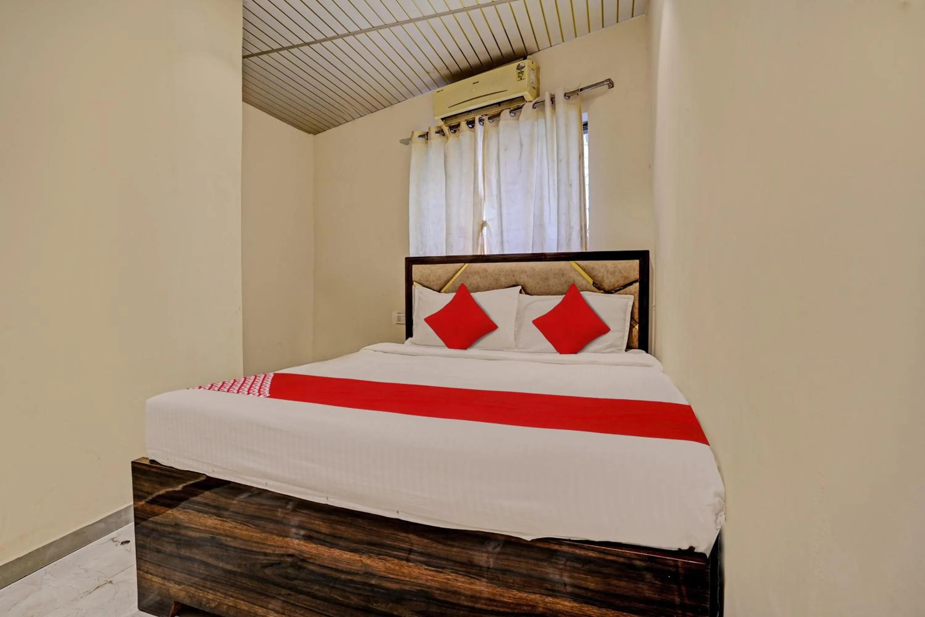 Bedroom in Hotel O NK Grand