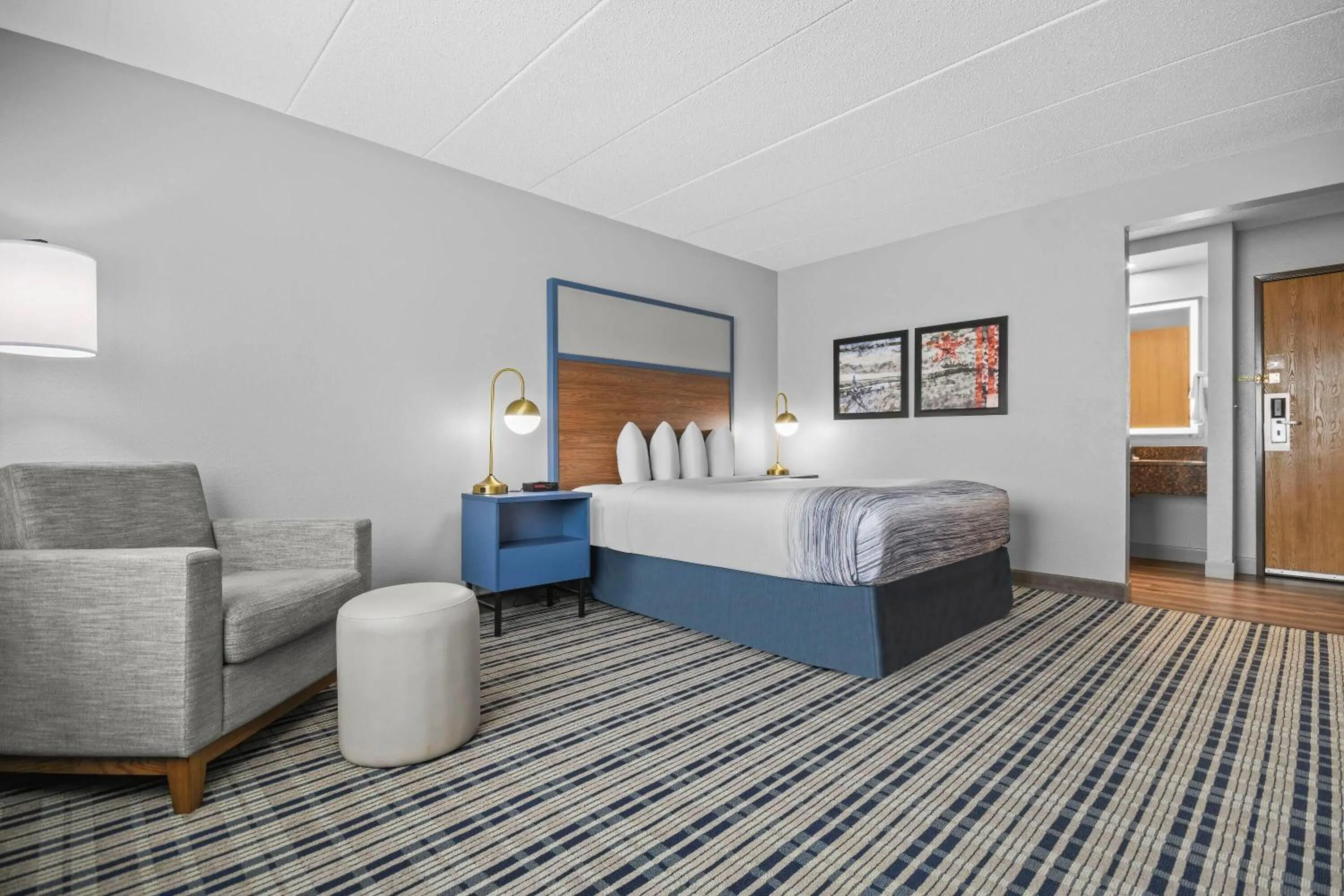 Bed in AmericInn by Wyndham Virginia