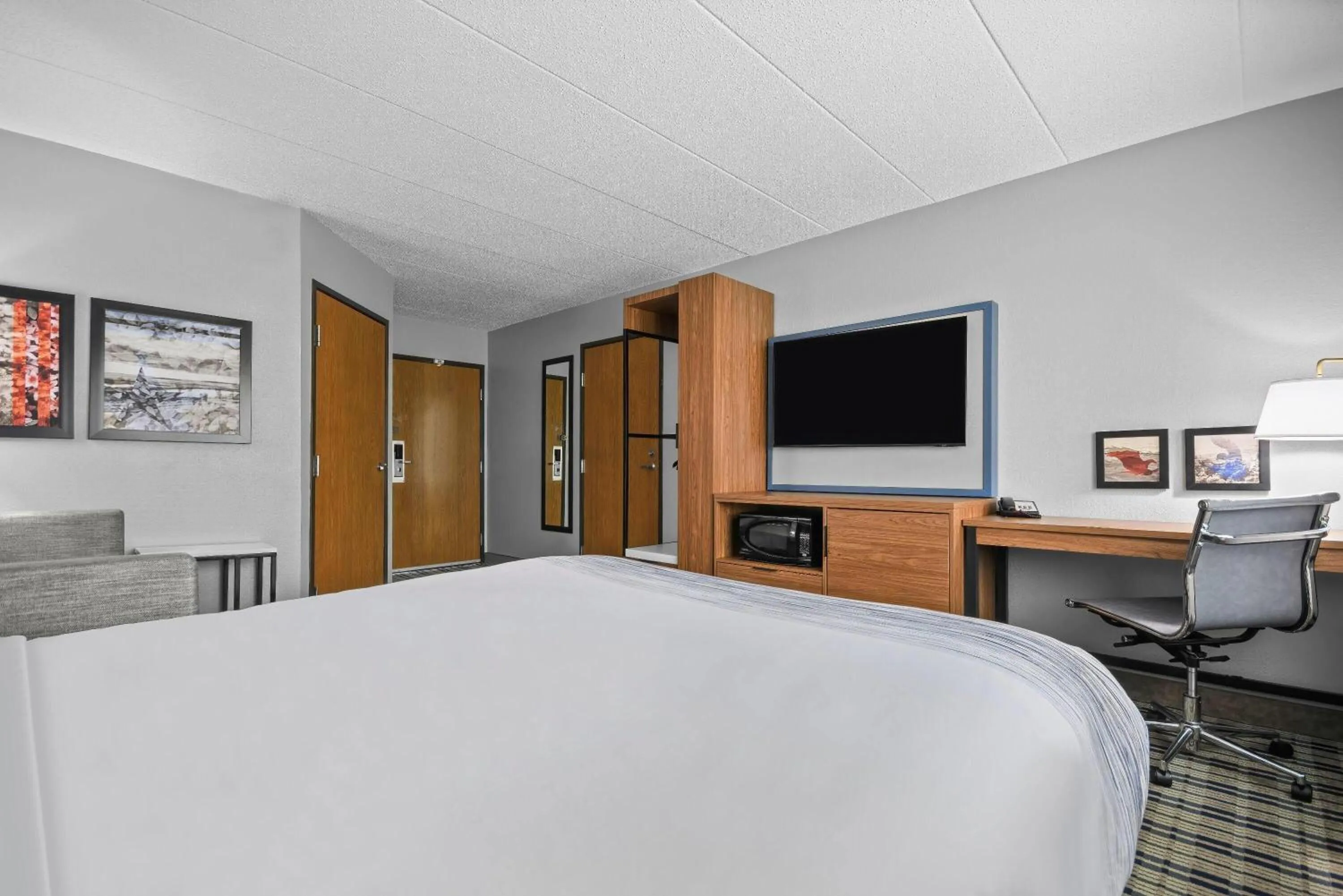 Bed in AmericInn by Wyndham Virginia