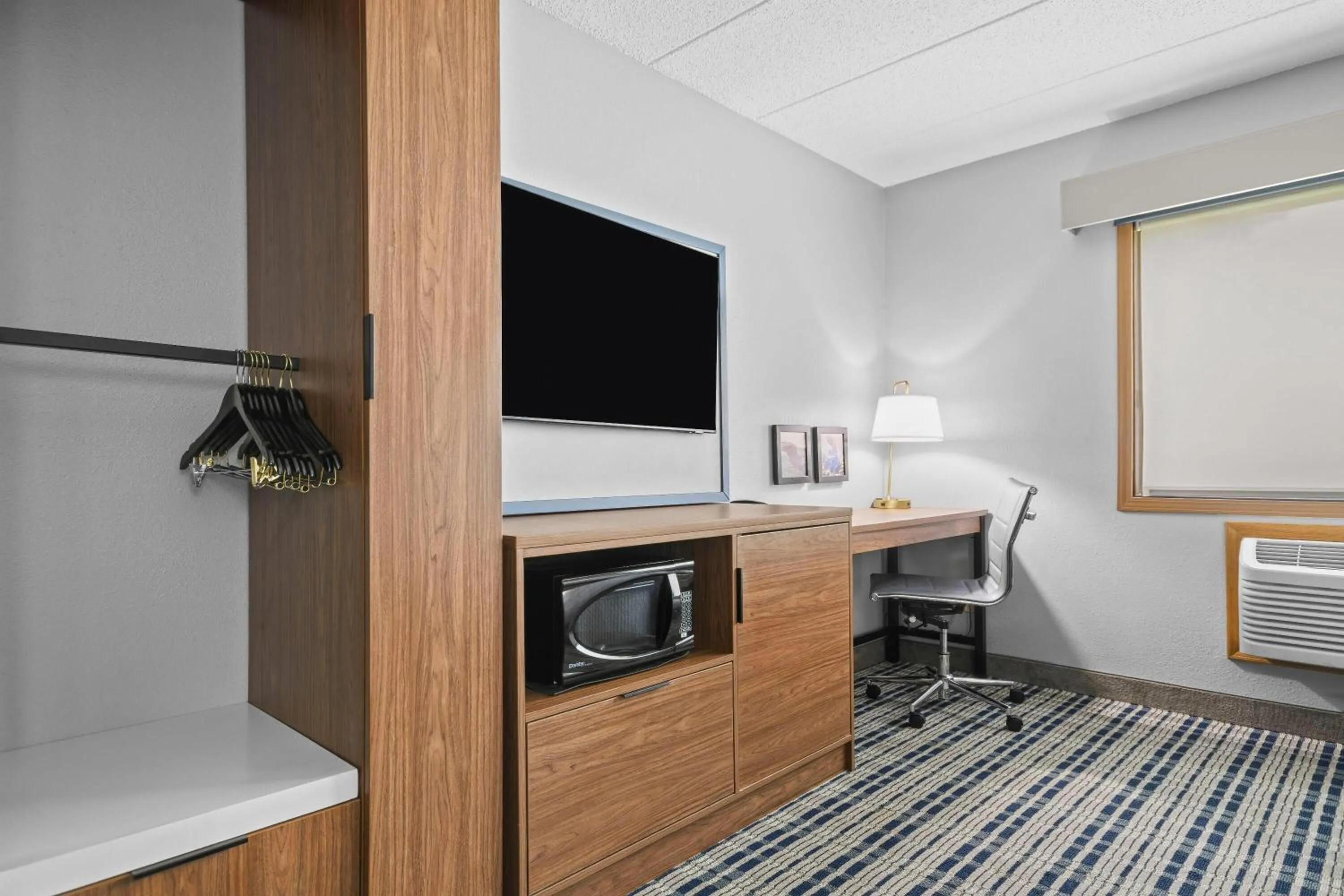 Bed in AmericInn by Wyndham Virginia