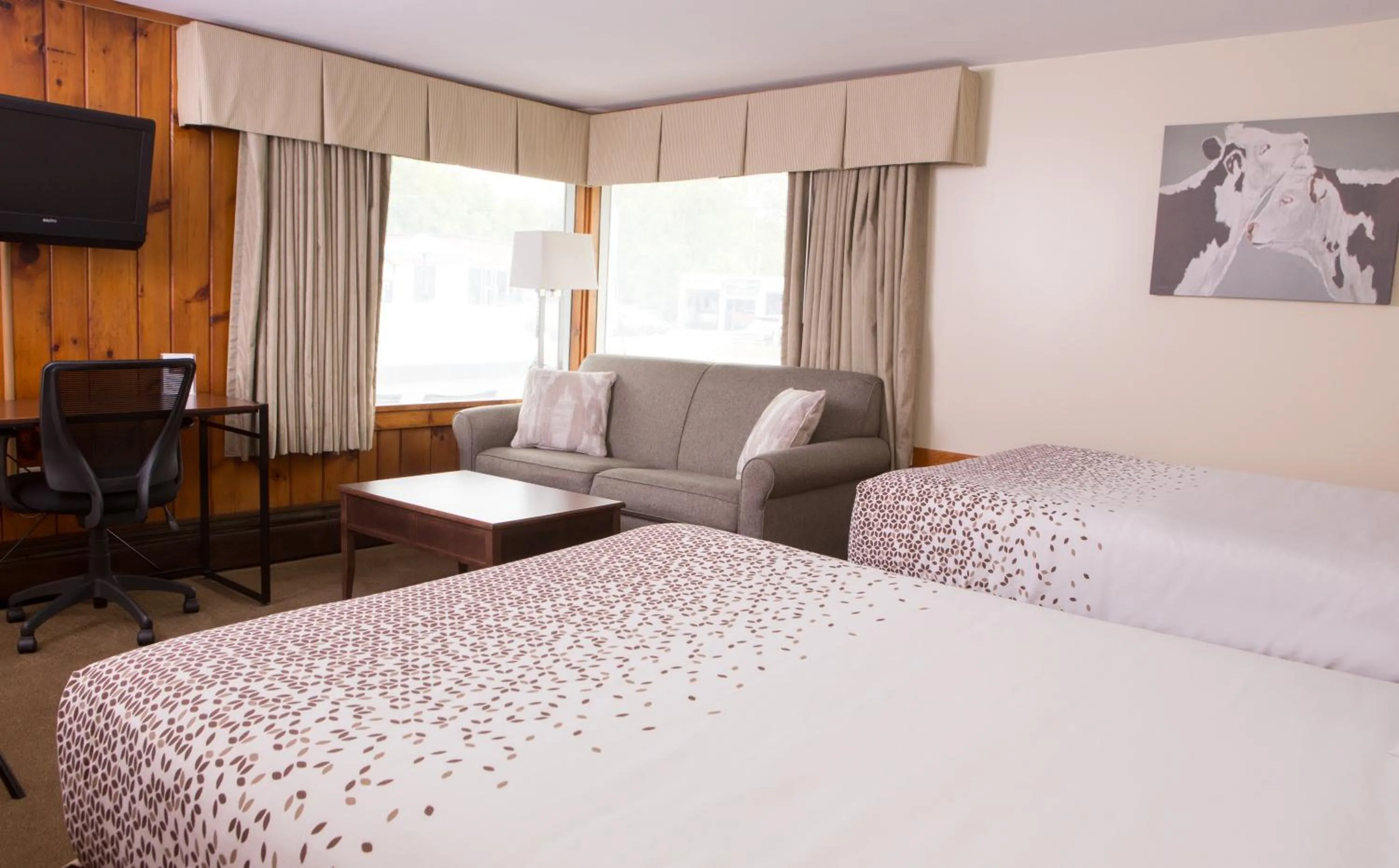 Bed in Knotty Pine Motel