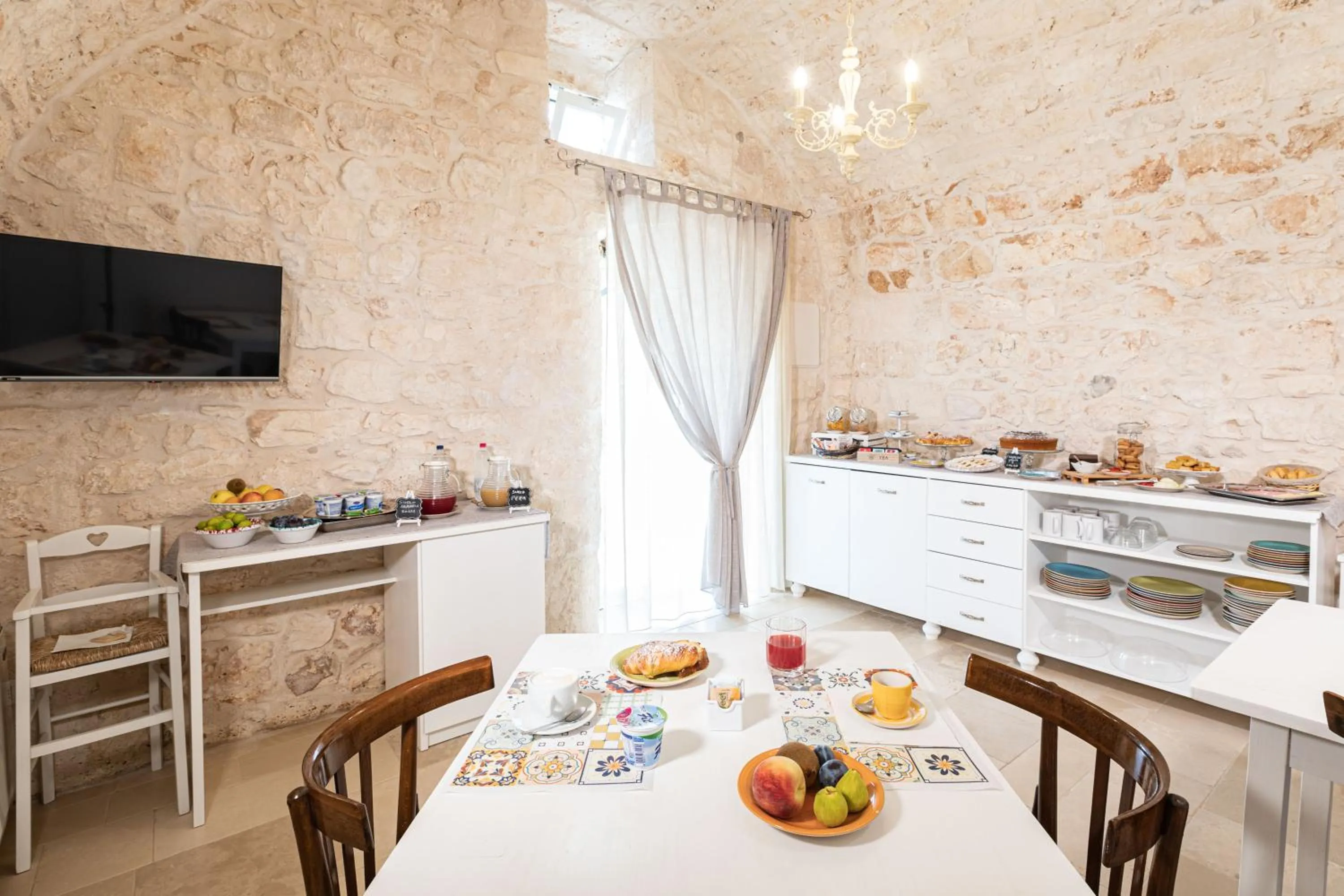 Communal lounge/ TV room in Masseria Abadia Uno