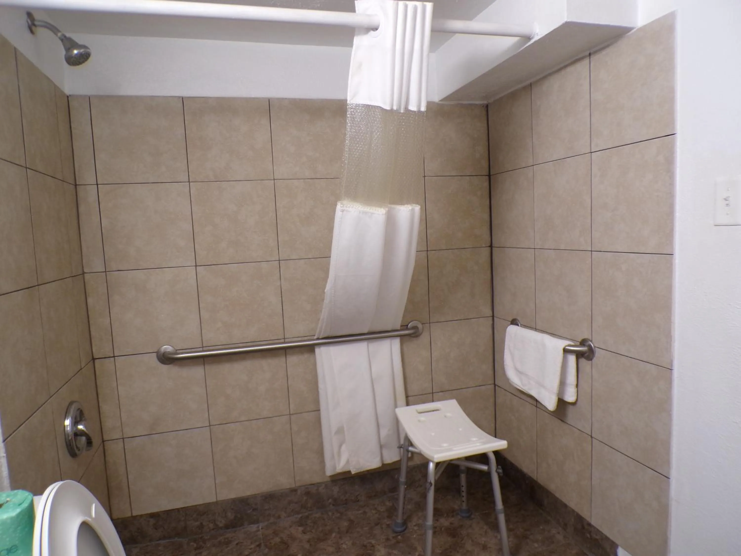Shower in Regal 8 Inn & Suites