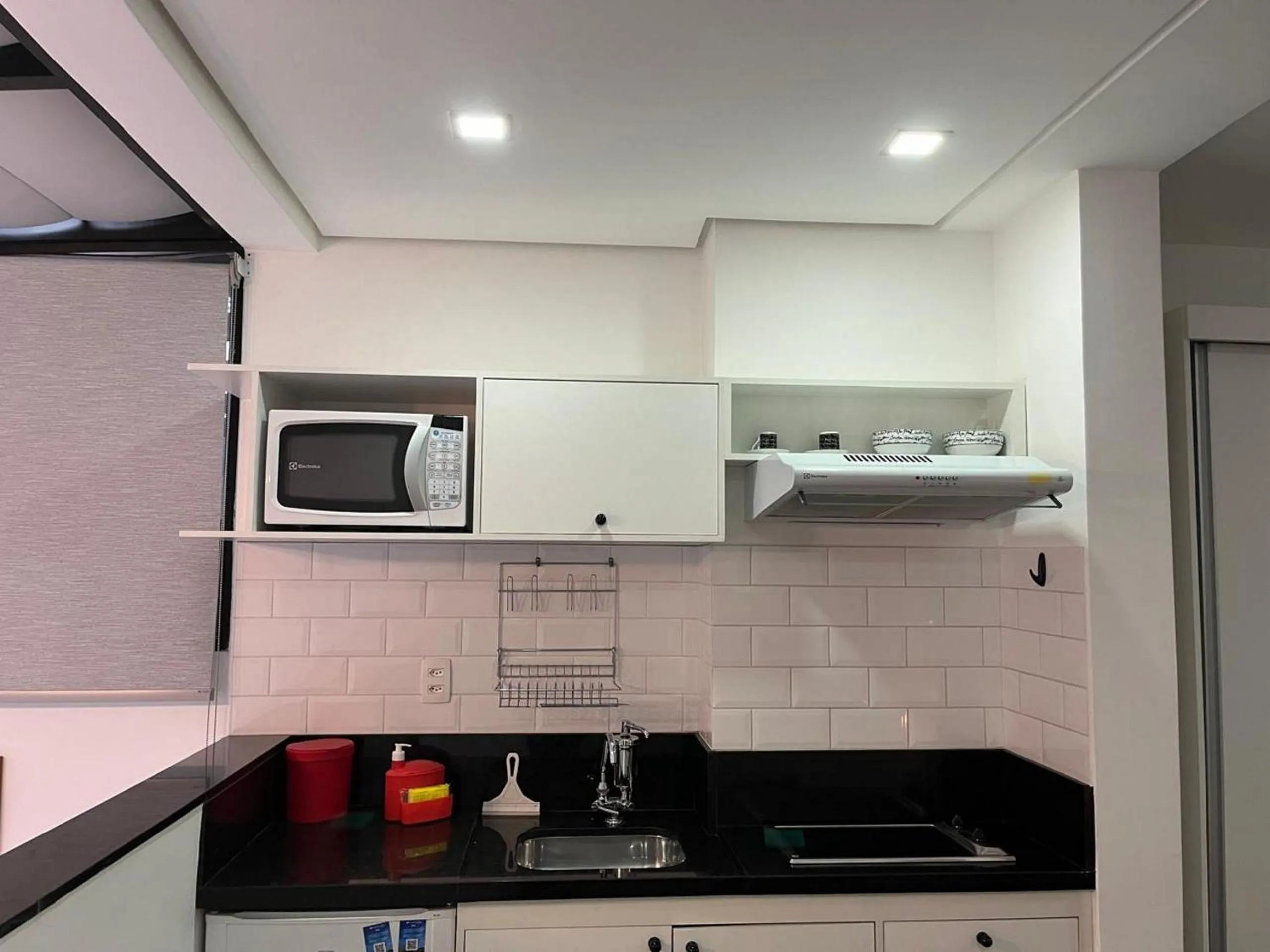 Kitchen or kitchenette in Elegance Suítes Carvalho