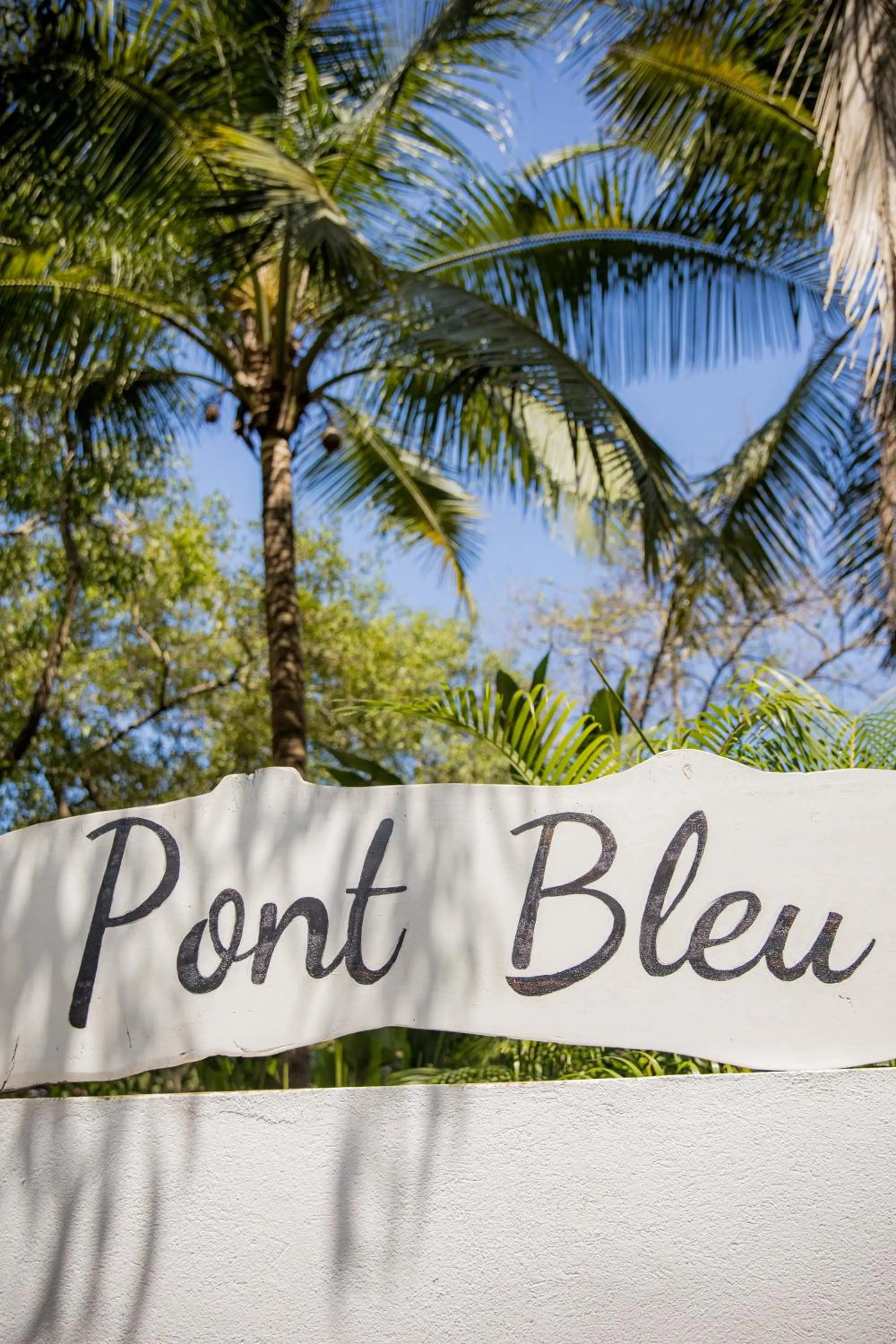 Property logo or sign in Pont Bleu Suites Riverside & Pool