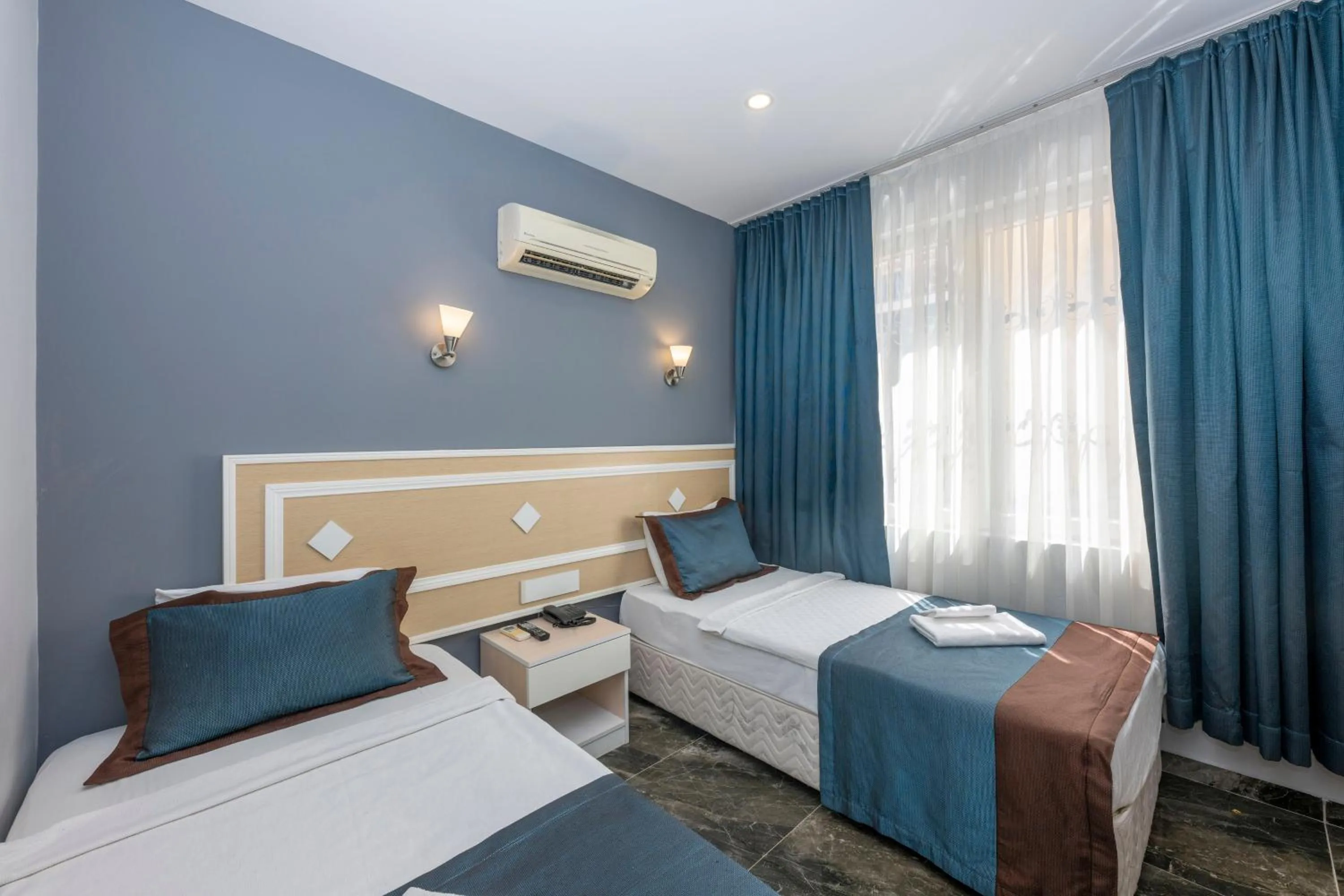 Bed in LEGEND TULIP HOTEL