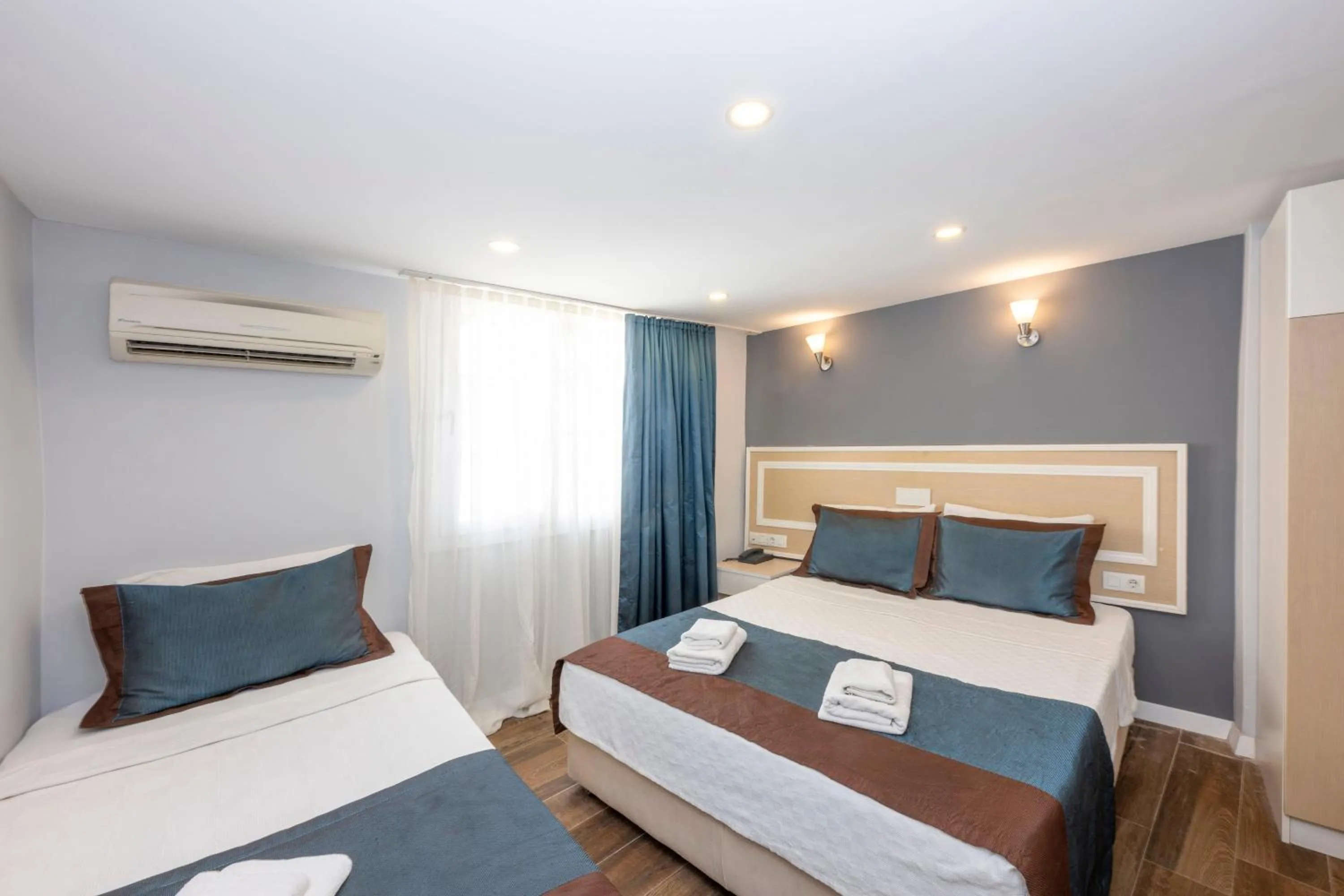 Bed in LEGEND TULIP HOTEL