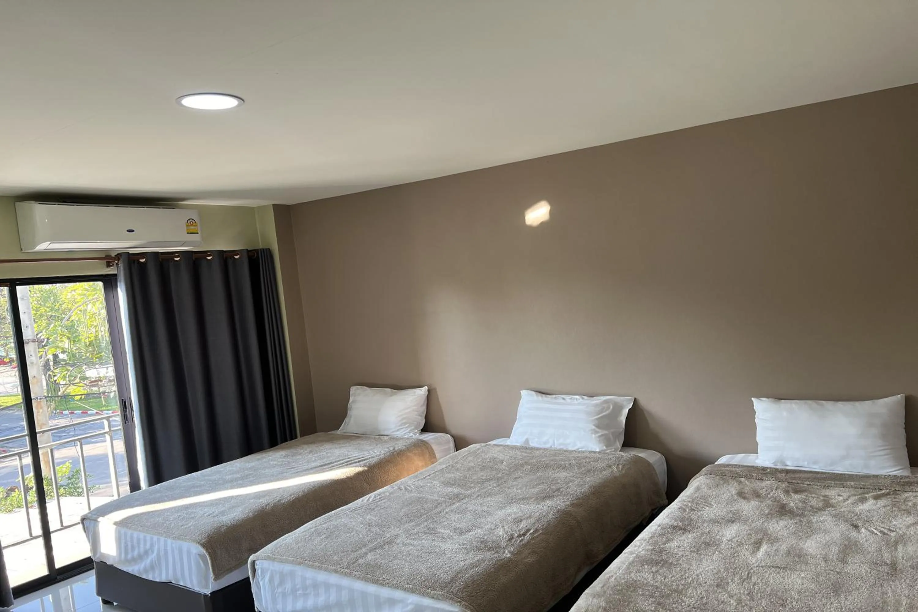 Bed in V Tharm Hotel