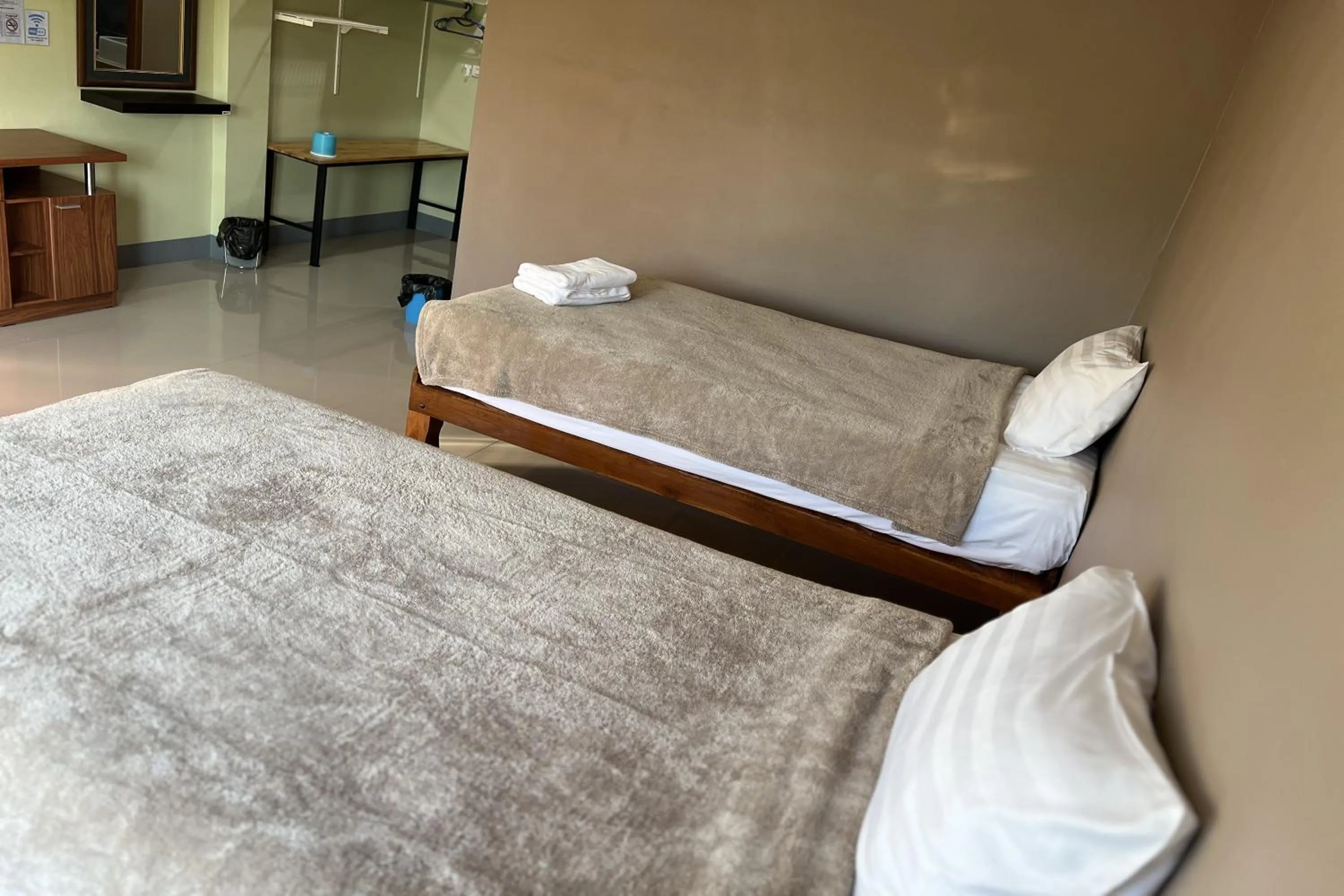 Bed in V Tharm Hotel