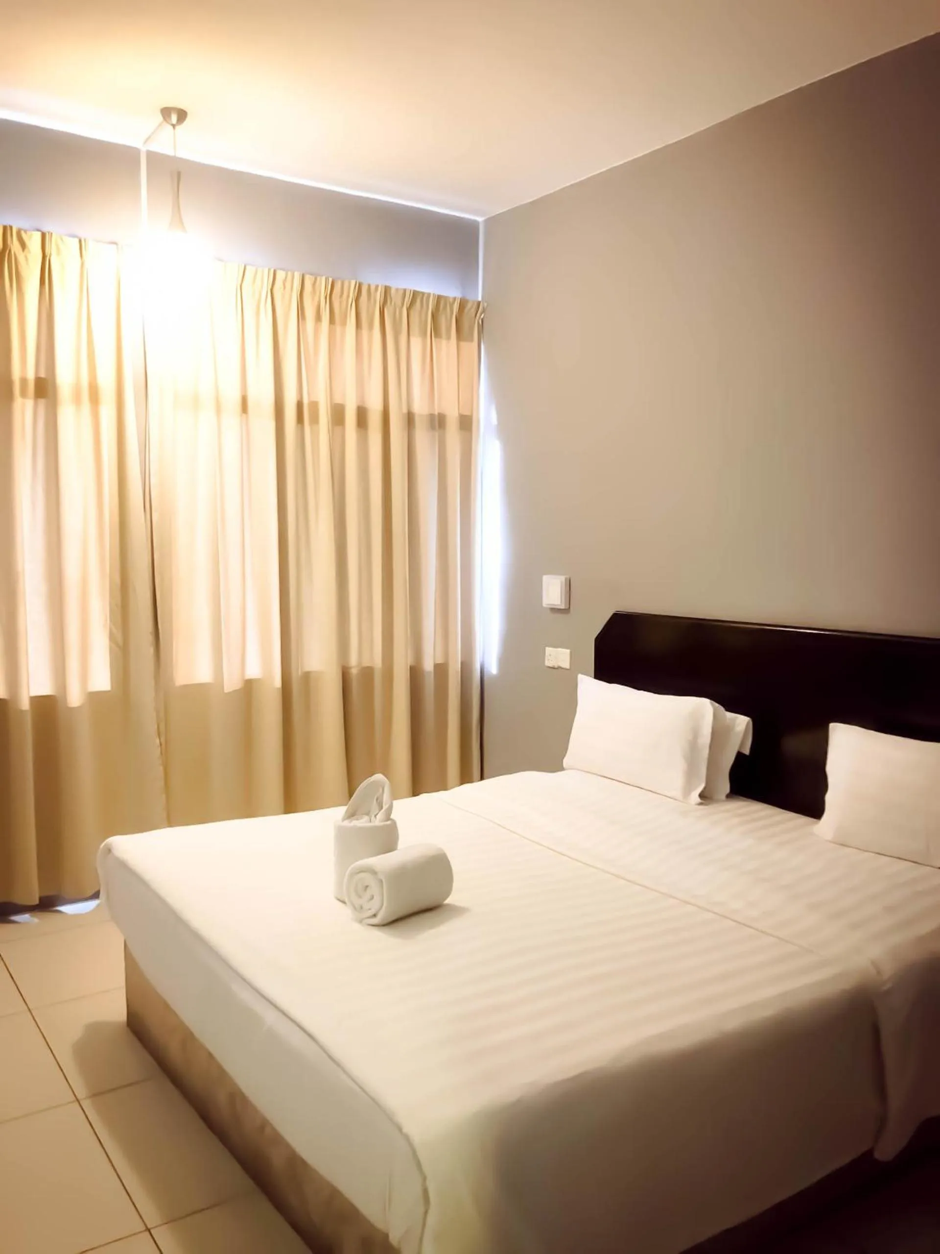 Bed in De Choice Hotel Tawau