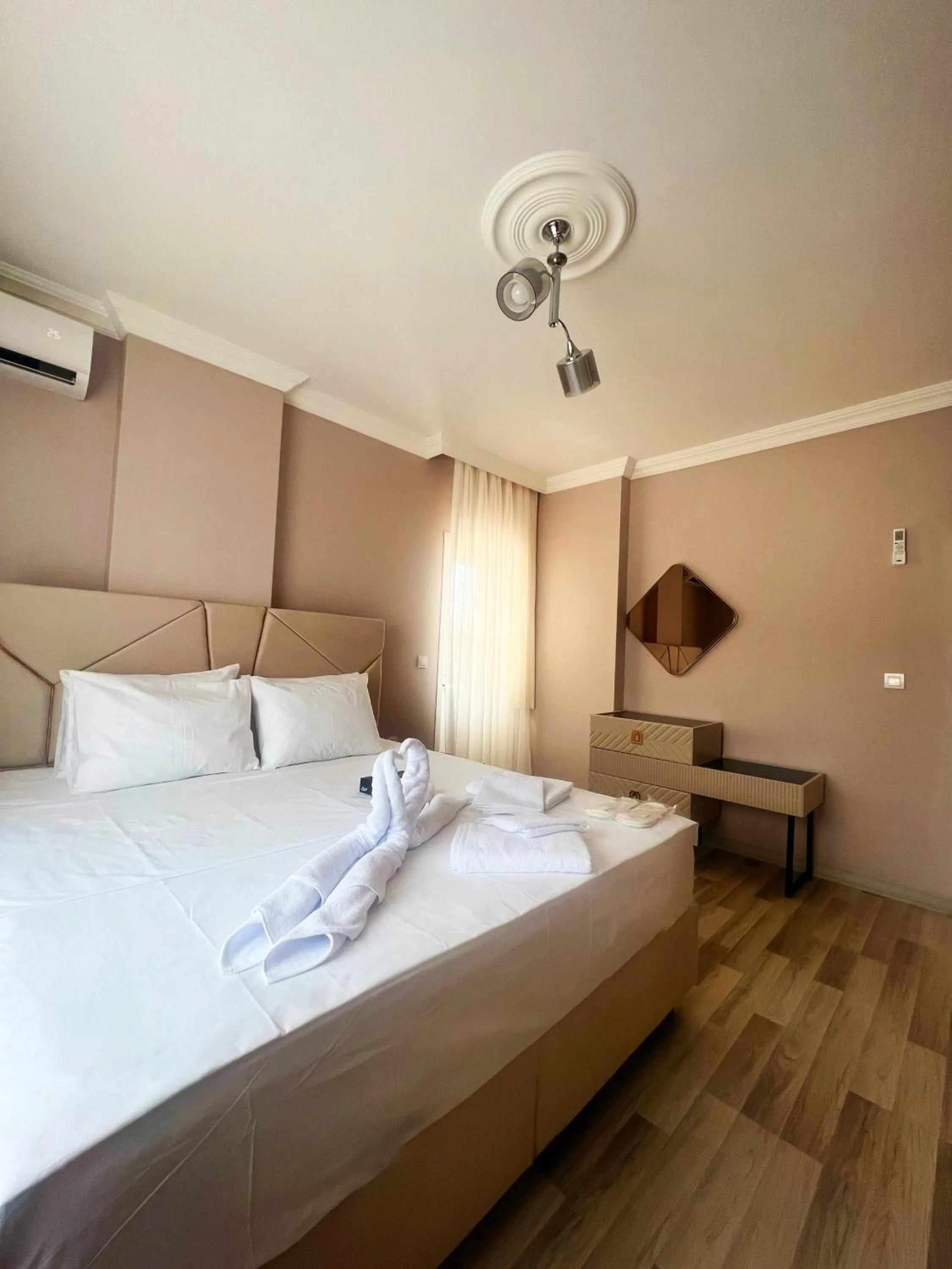 Bed in Seabird Suite Apart Hotel