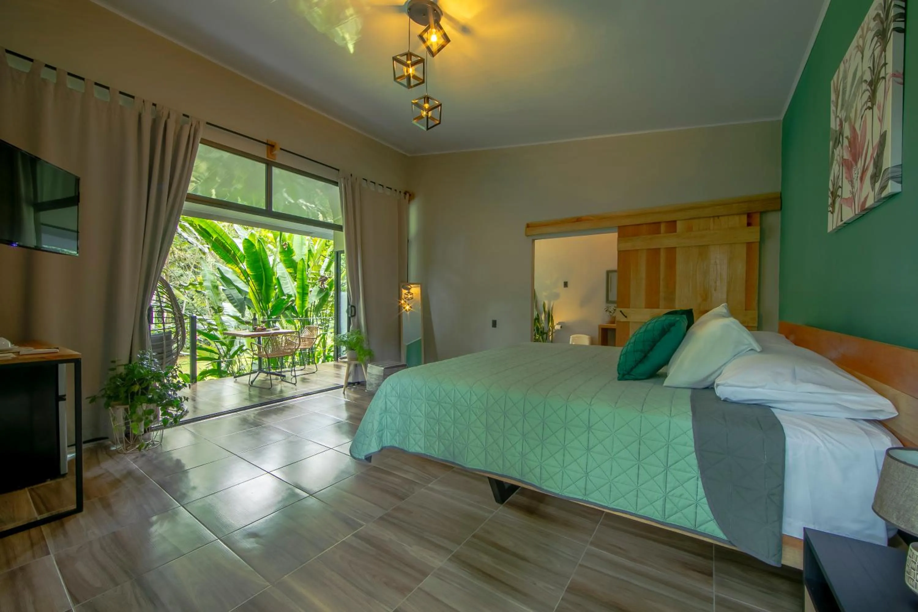 Communal lounge/ TV room, Bed in Eden Organic Farm & Bungalows