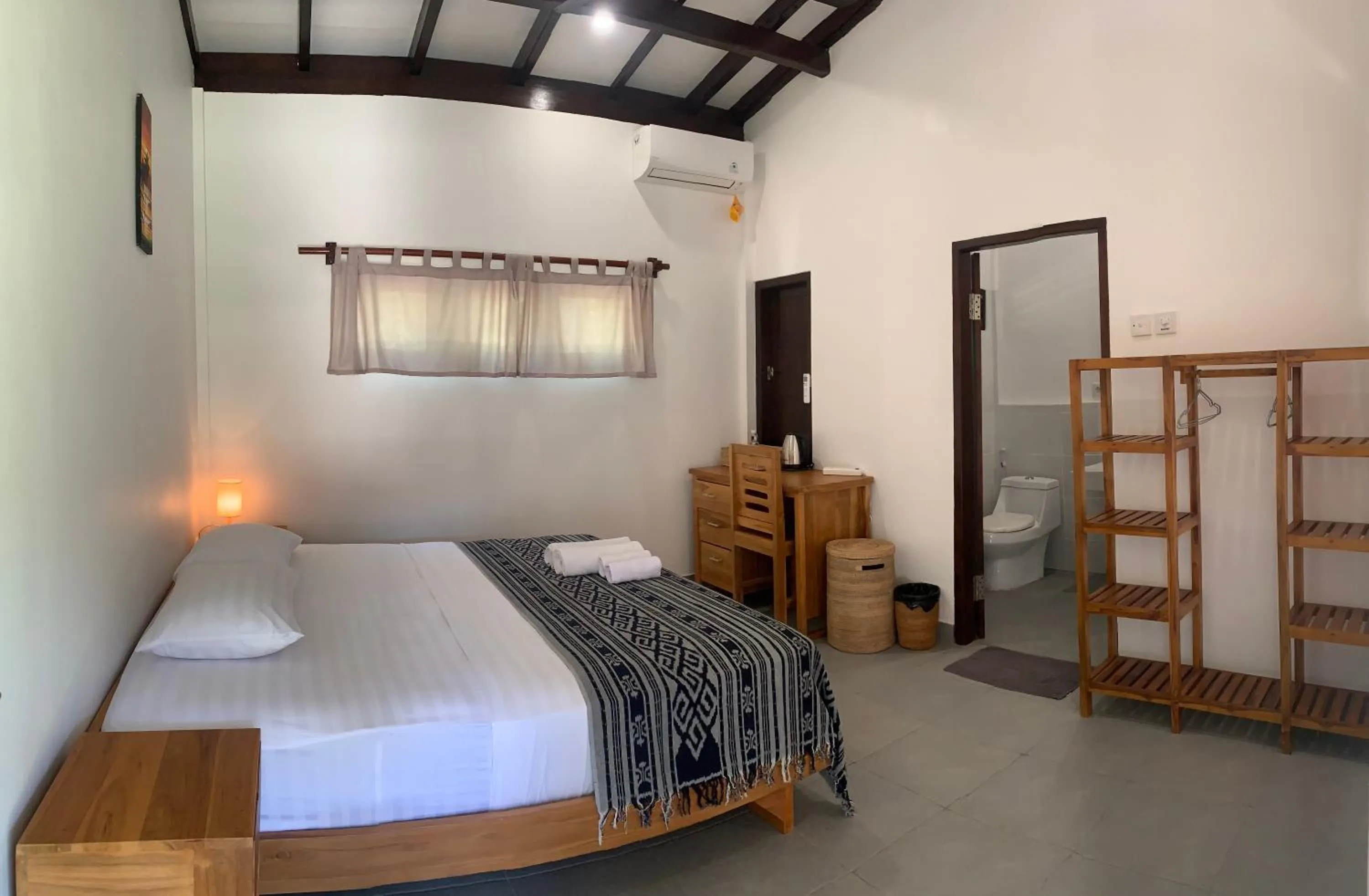 Photo of the whole room, Bed in Balong Balong Surf Bungalows & Restaurant
