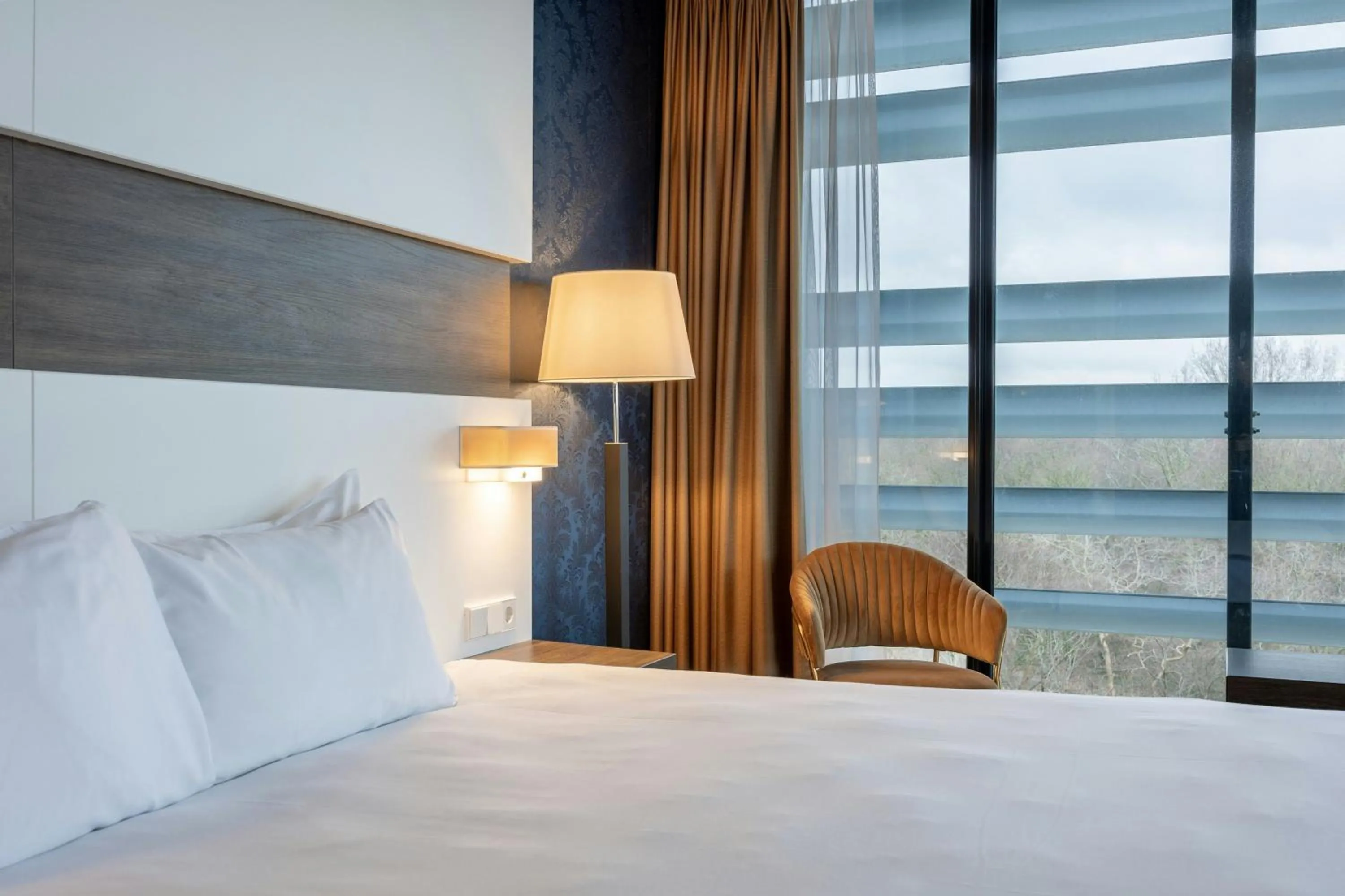 Bedroom, Bed in Leonardo Royal Hotel Den Haag Promenade