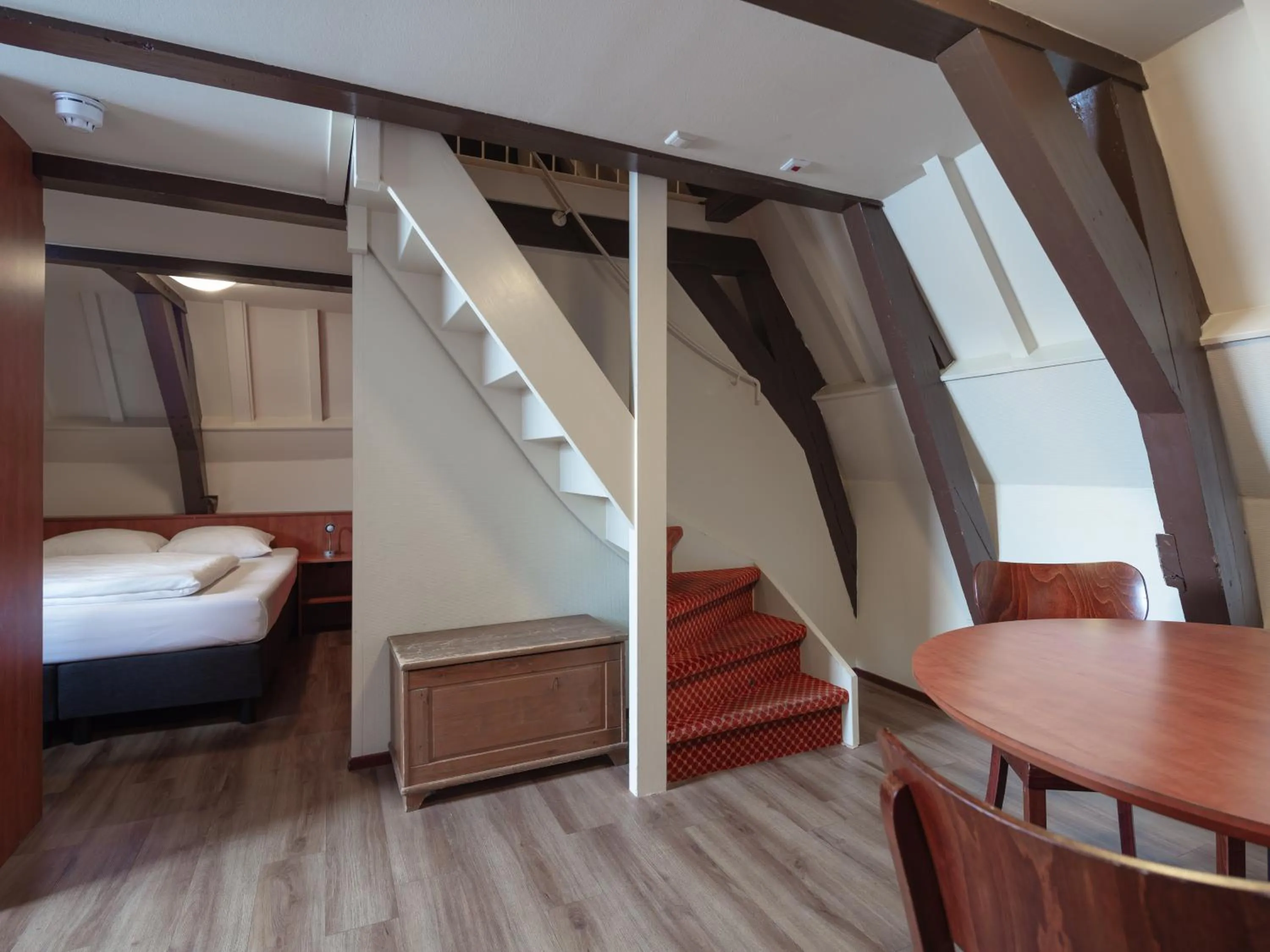 Bed in A-Train Hotel