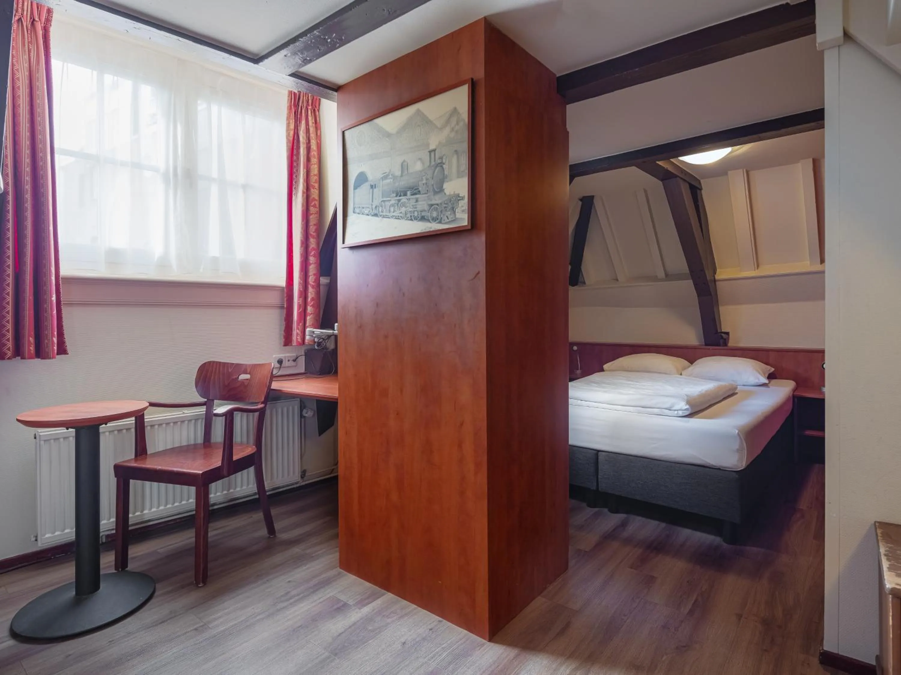 Bed in A-Train Hotel