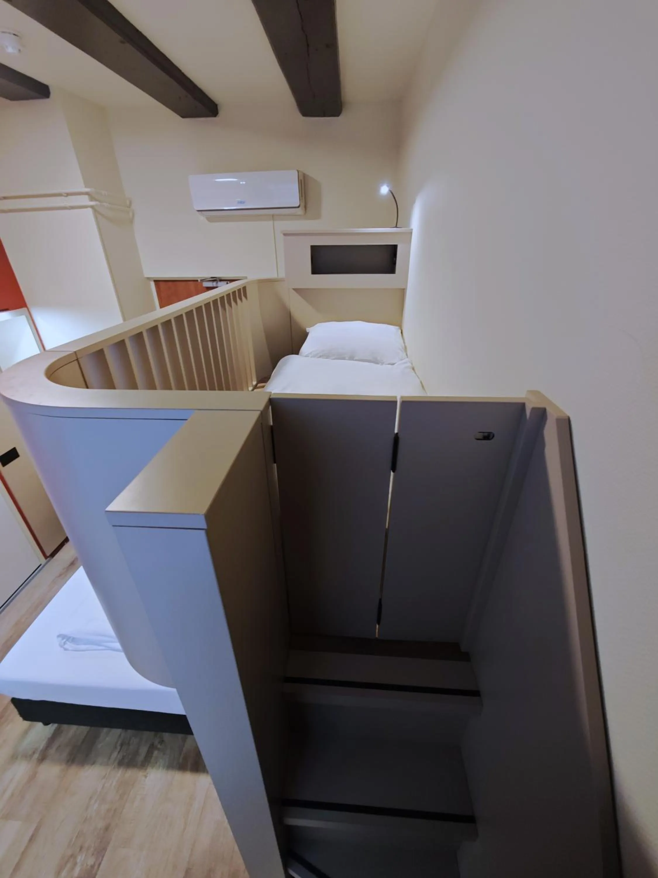 Bed in A-Train Hotel