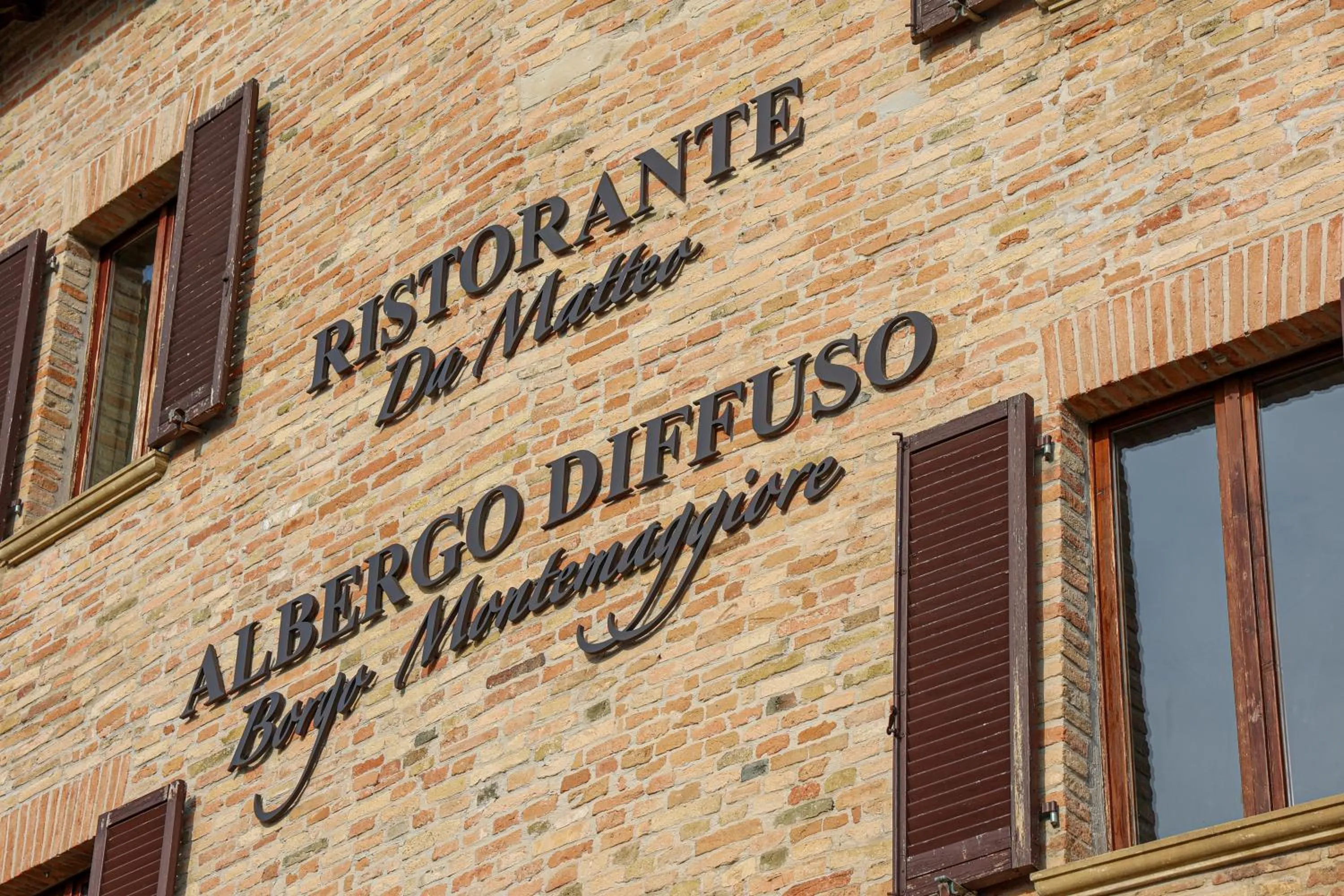 Property logo or sign in Albergo Diffuso Borgo Montemaggiore