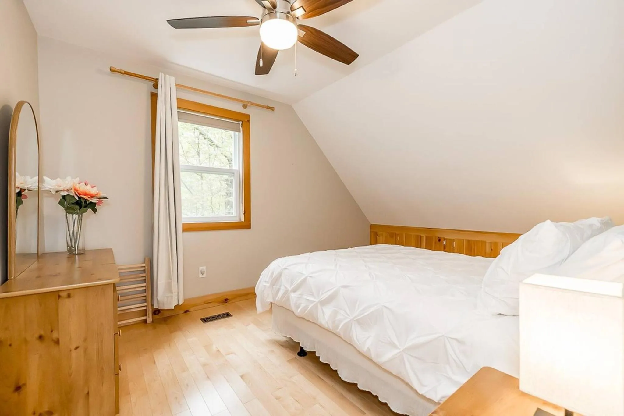 Bed in Muskoka Lakeshore Cottage Bliss