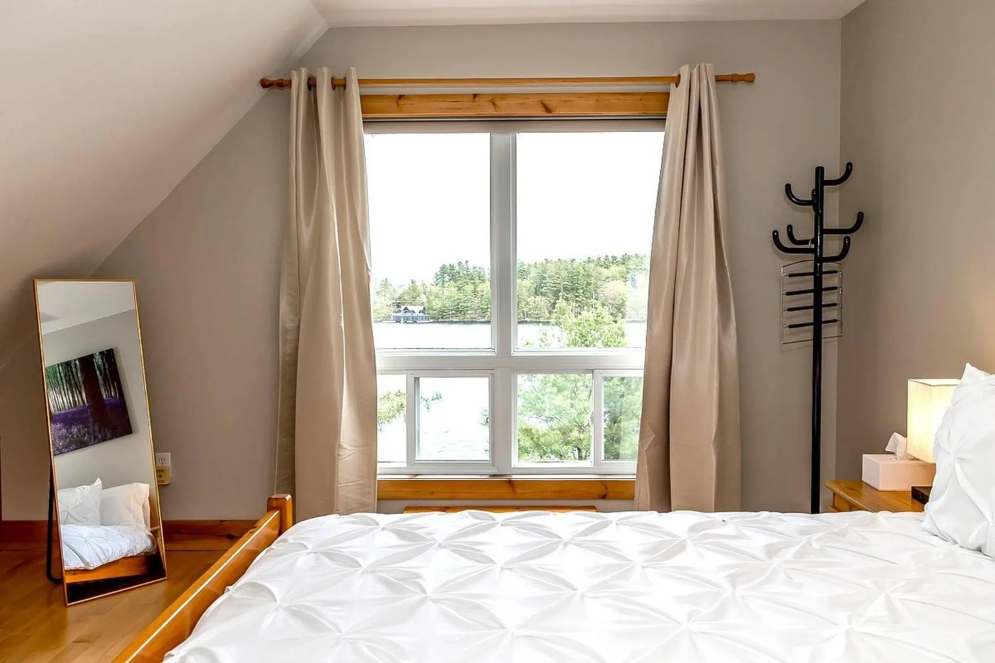 Bed in Muskoka Lakeshore Cottage Bliss