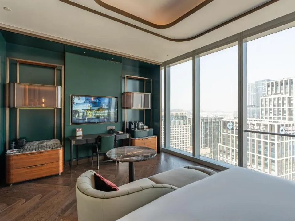 Living room, Bed in MGM Qingdao