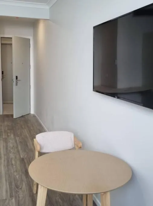 Communal lounge/ TV room in AWA Hotel