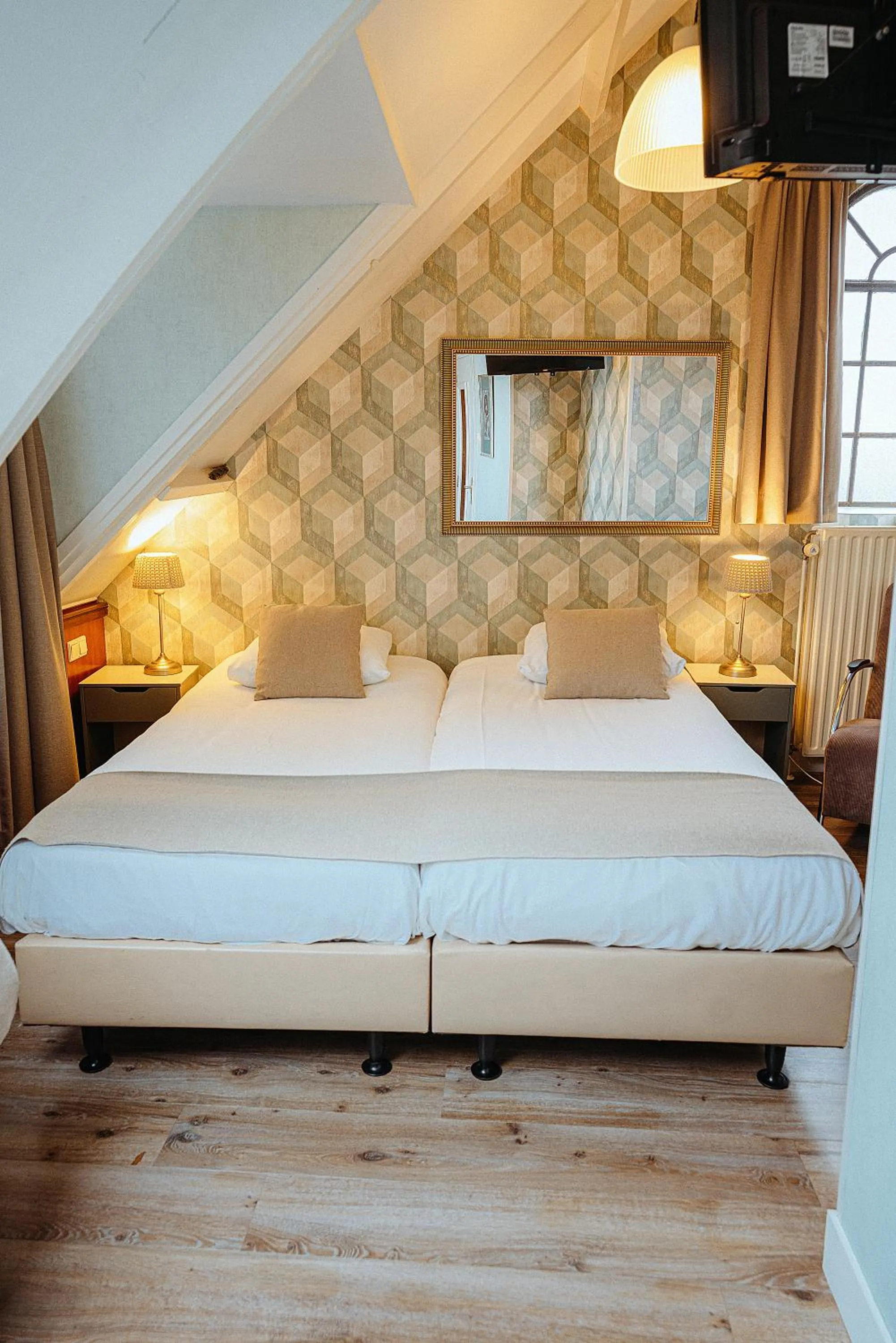 Bed in Hotel Johannes Vermeer Delft