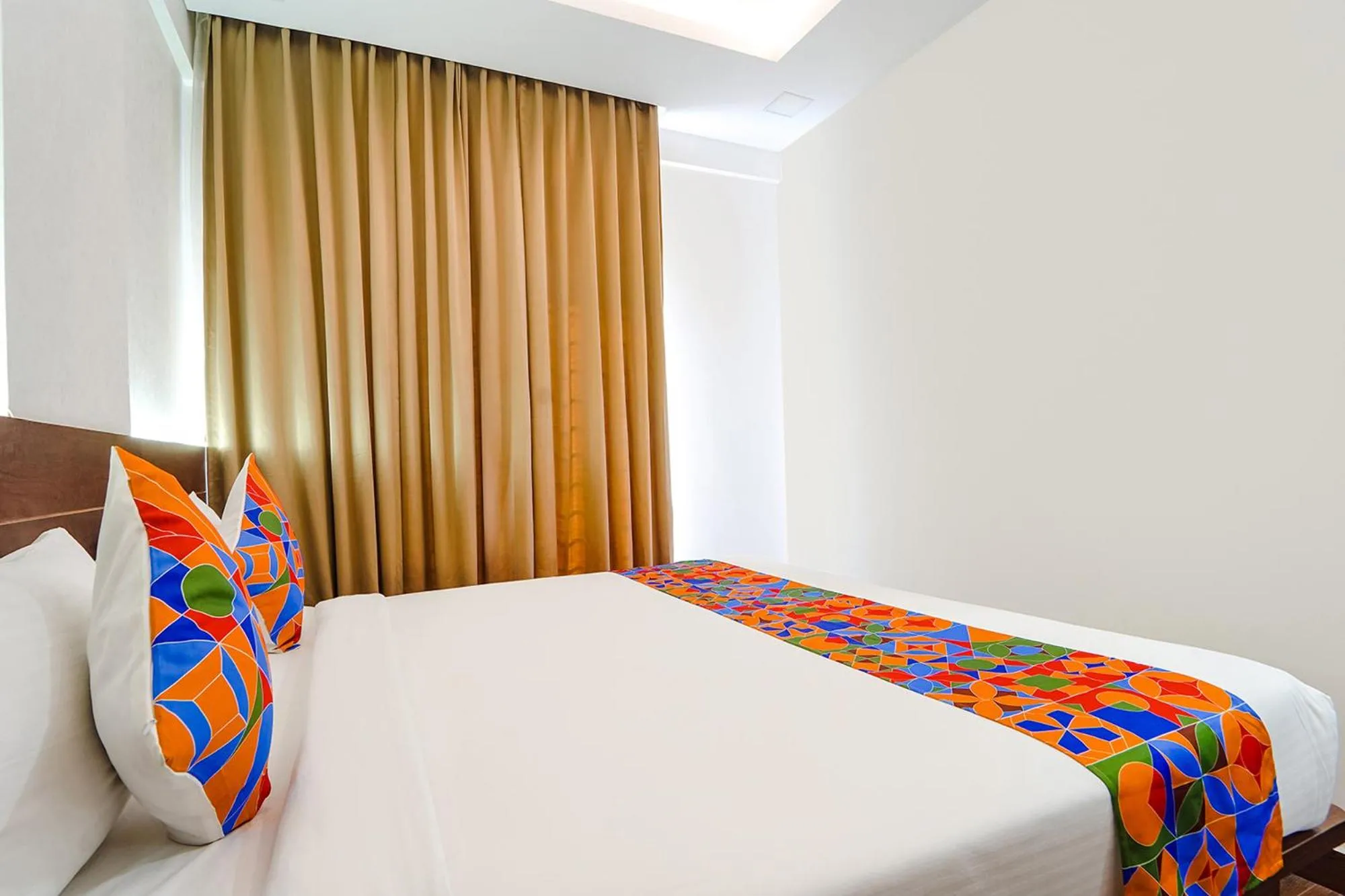 Bed in FabHotel Ellegant Inn