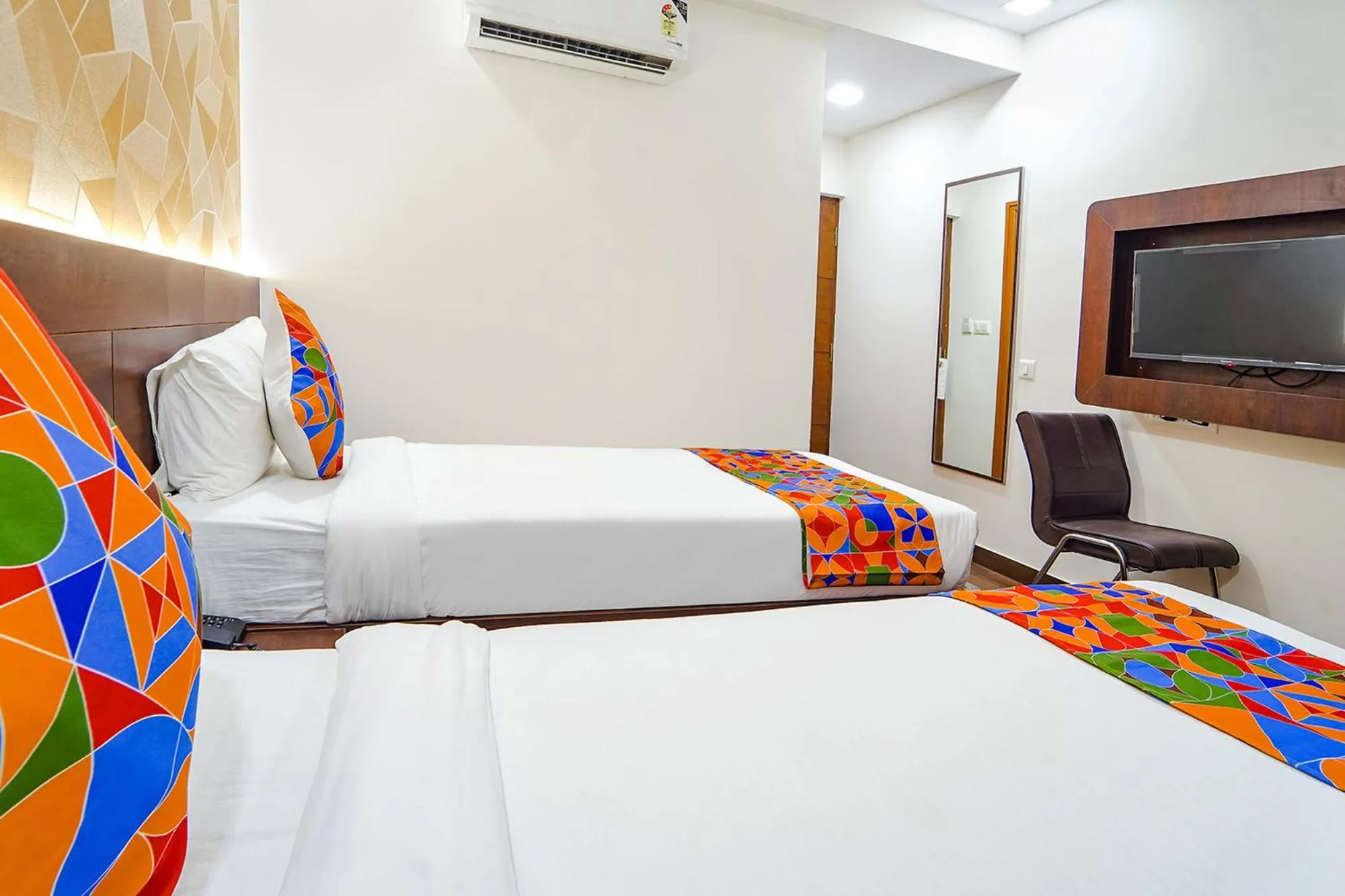 Bed in FabHotel Ellegant Inn