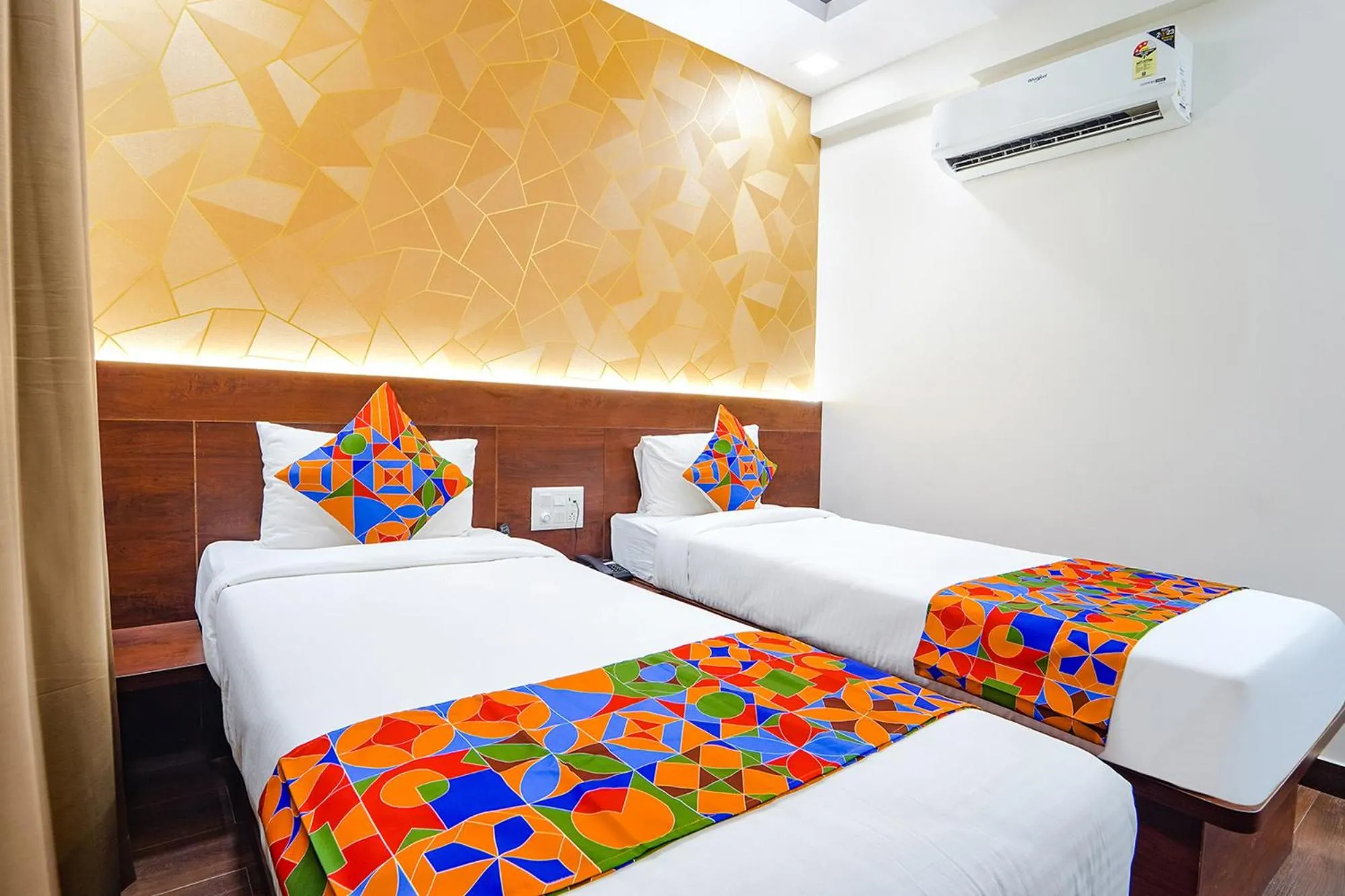 Bed in FabHotel Ellegant Inn