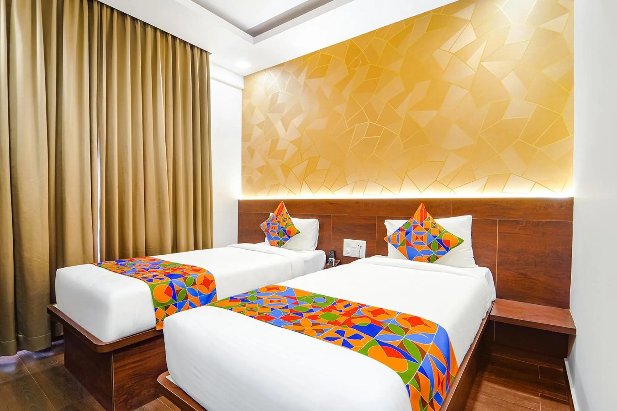 Bed in FabHotel Ellegant Inn