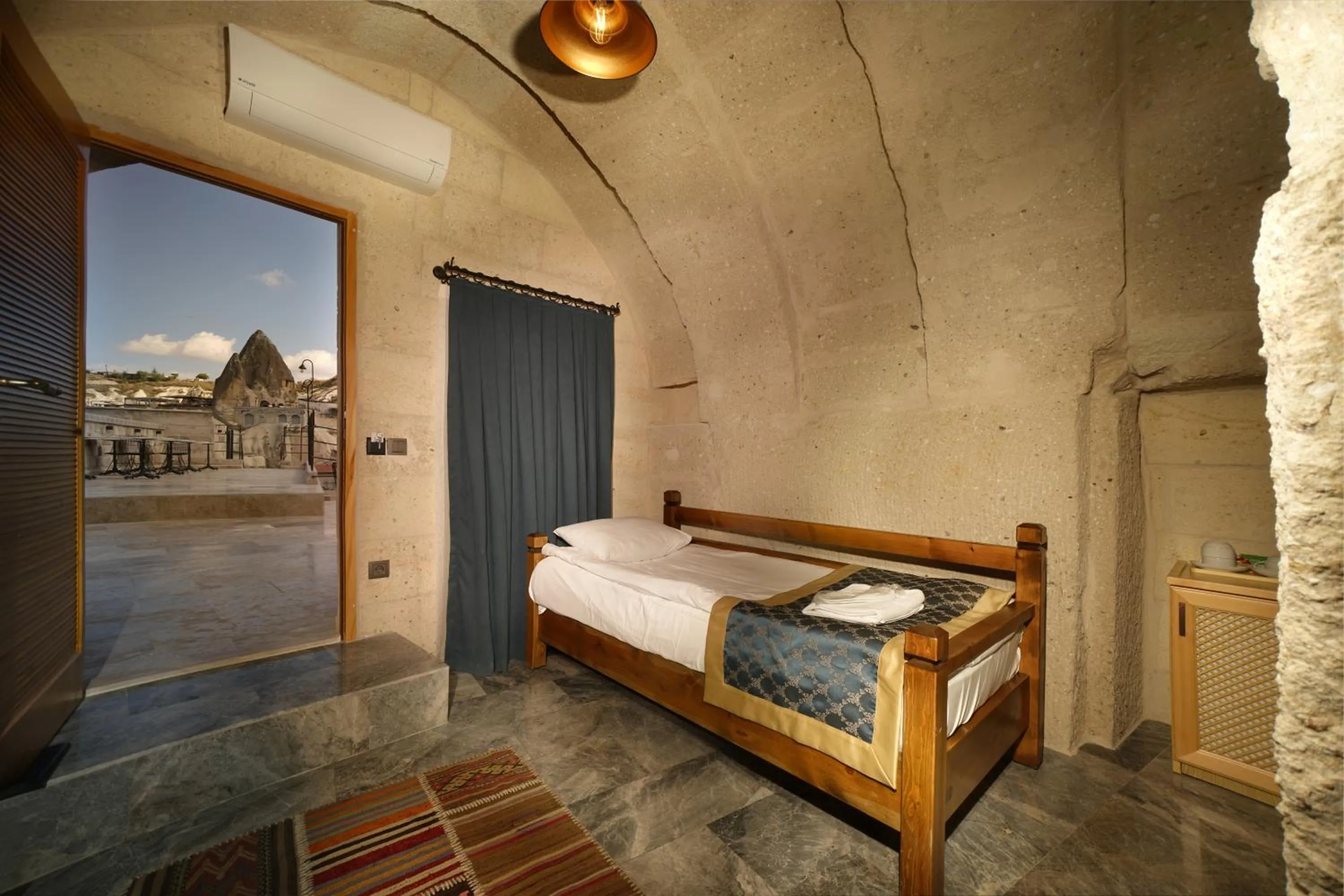 Bed in Caverna Hotel Premium Caves