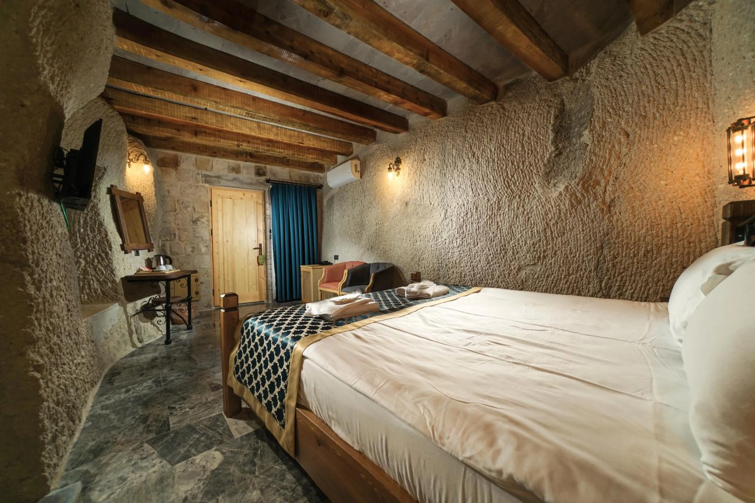 Bed in Caverna Hotel Premium Caves