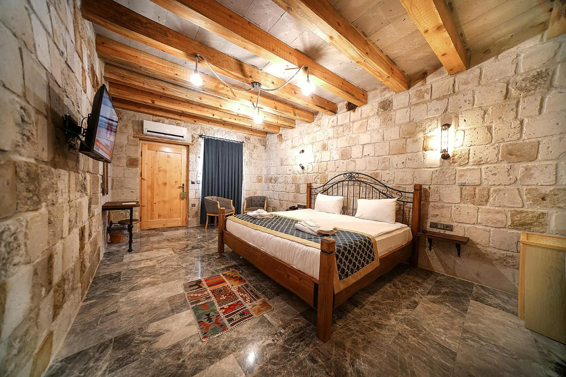 Bed in Caverna Hotel Premium Caves