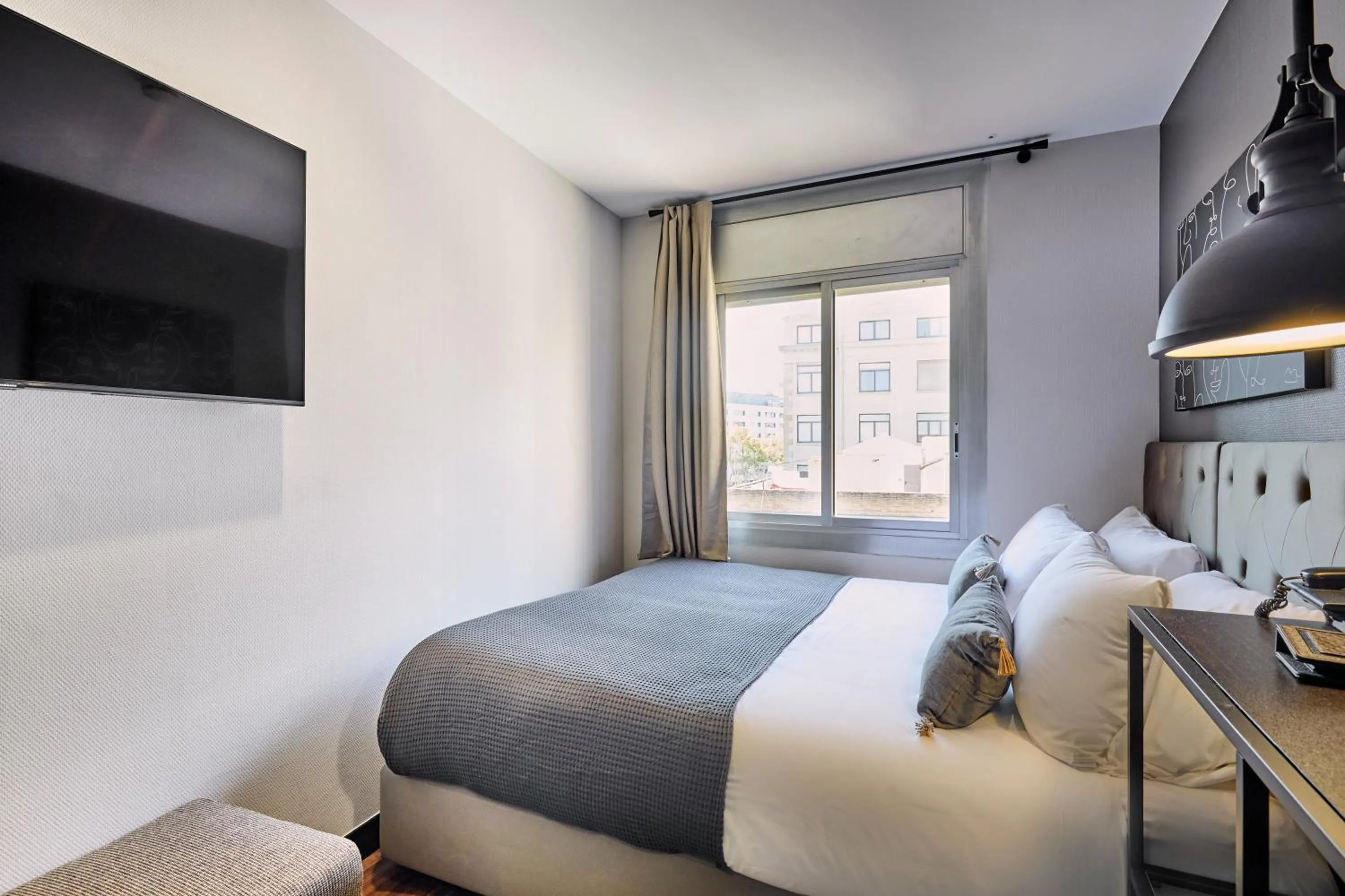 Bed in Hotel Cortes Rambla