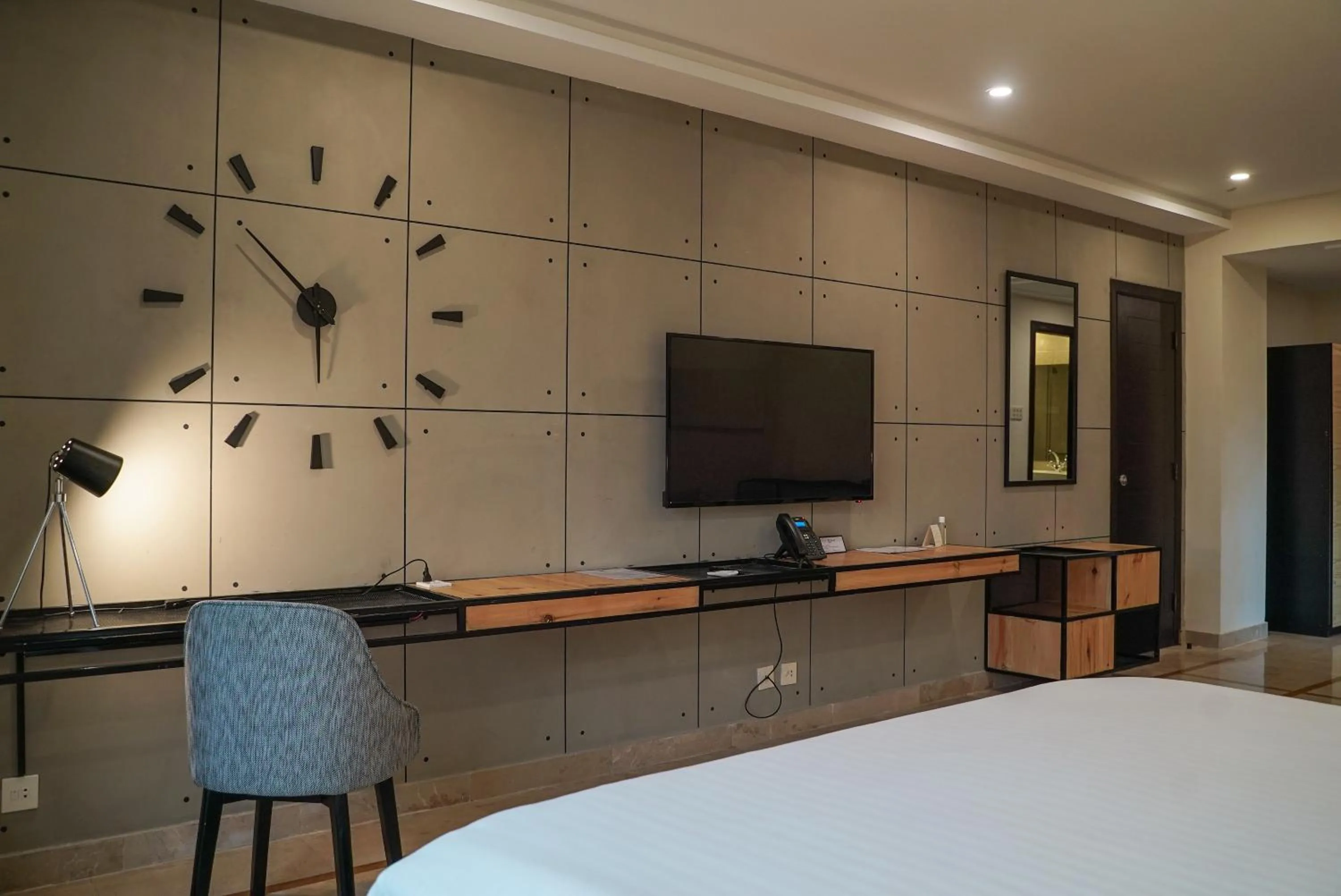 Bed in Roomy Signature Hotel, Islamabad