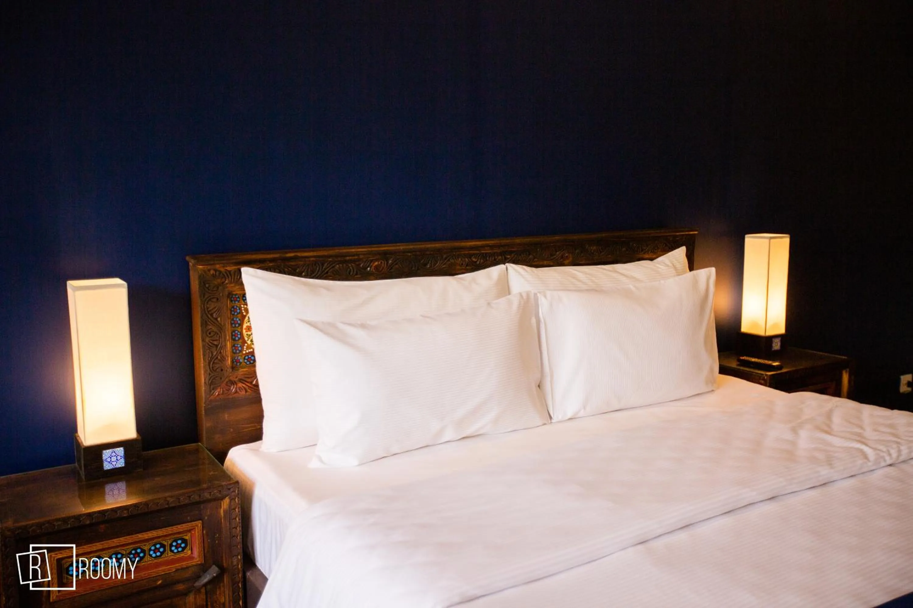 Bed in Roomy Signature Hotel, Islamabad