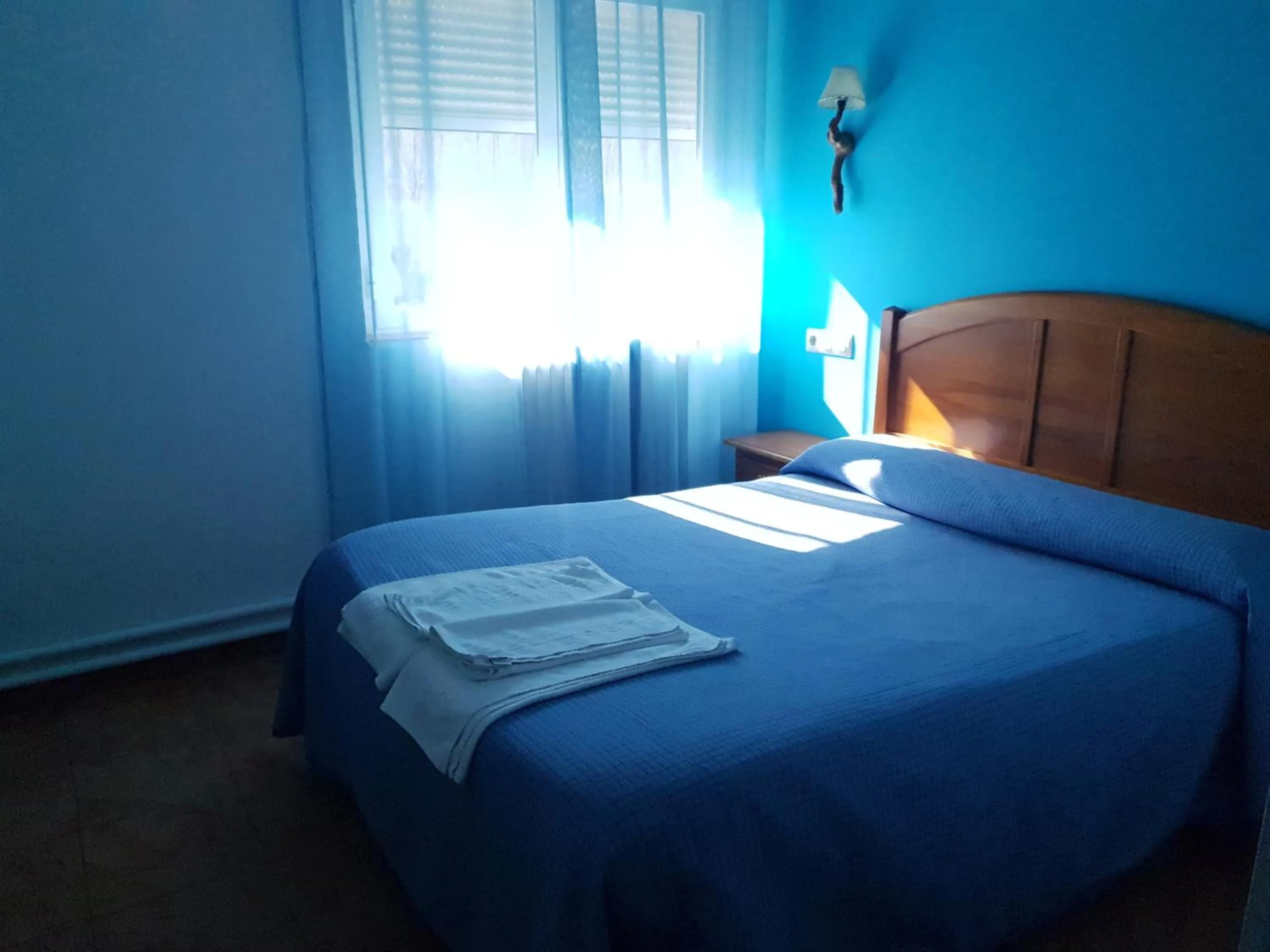 Bed in Hostal Río Mundo