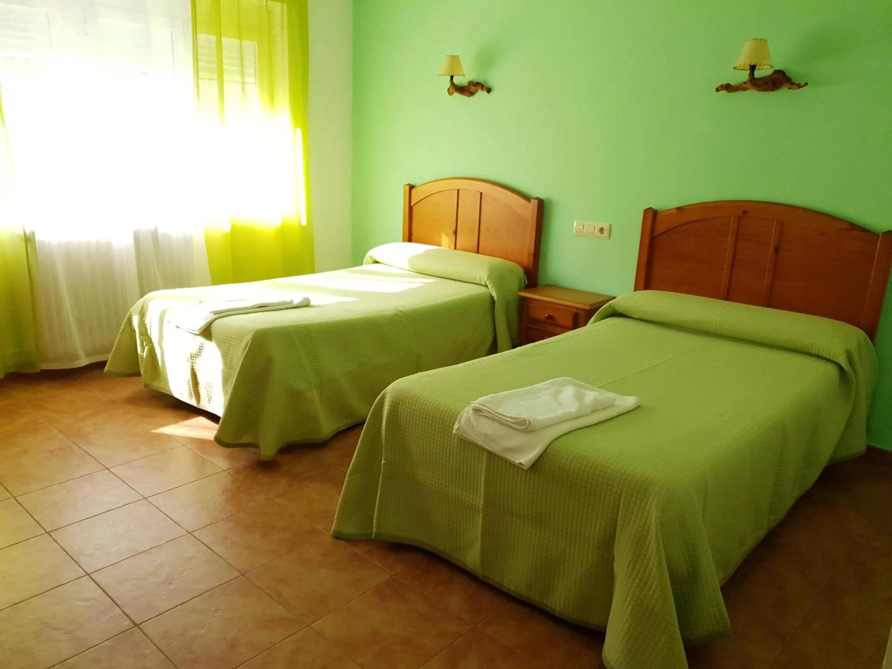 Bed in Hostal Río Mundo