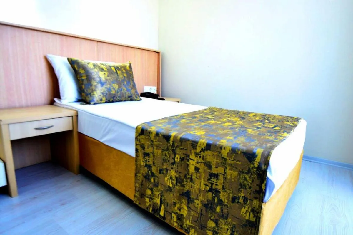 Bed in Side Orange Paradise Hotel