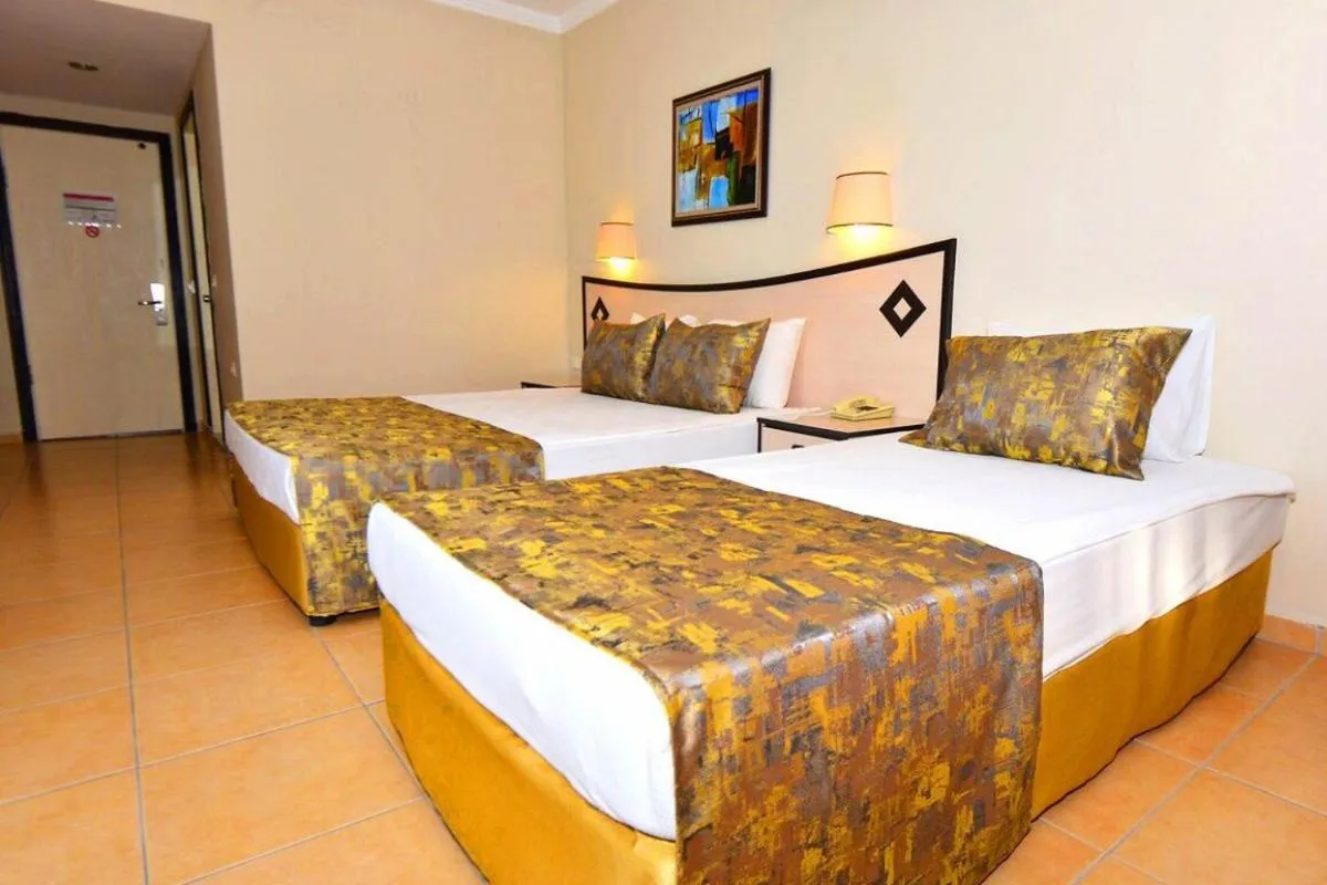 Bed in Side Orange Paradise Hotel