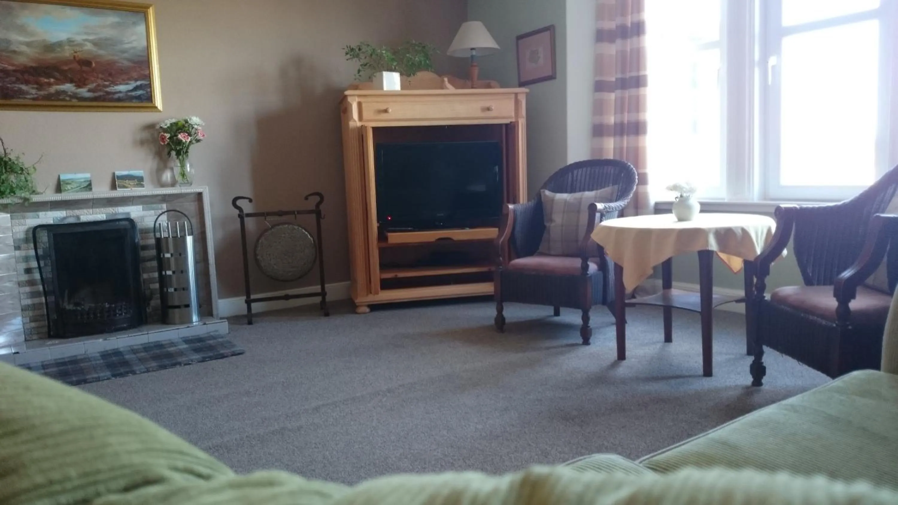 Communal lounge/ TV room in Bettyhill Hotel