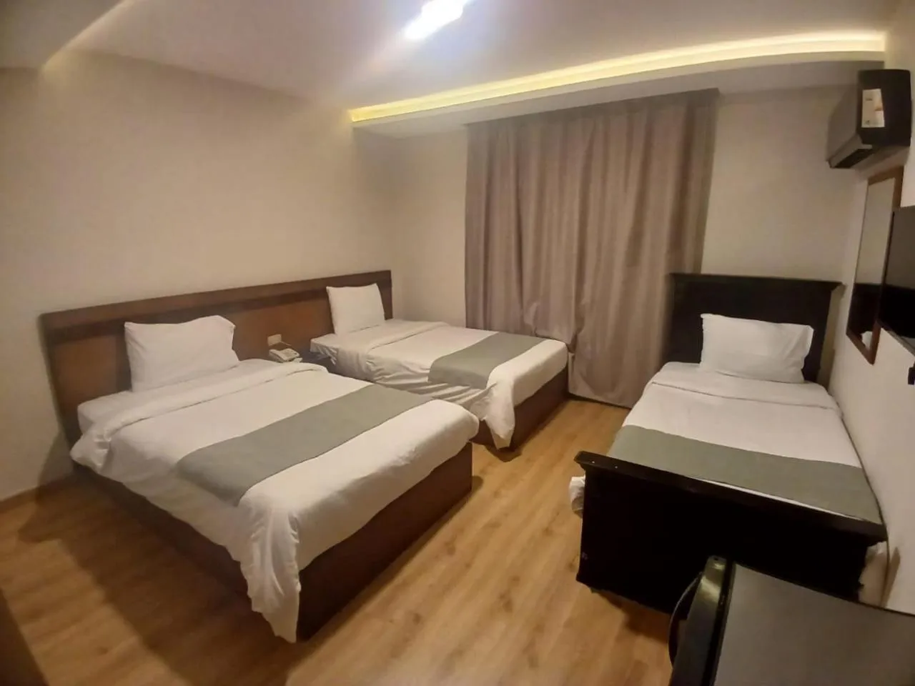 Bed in Miramar Evergreen Hotel