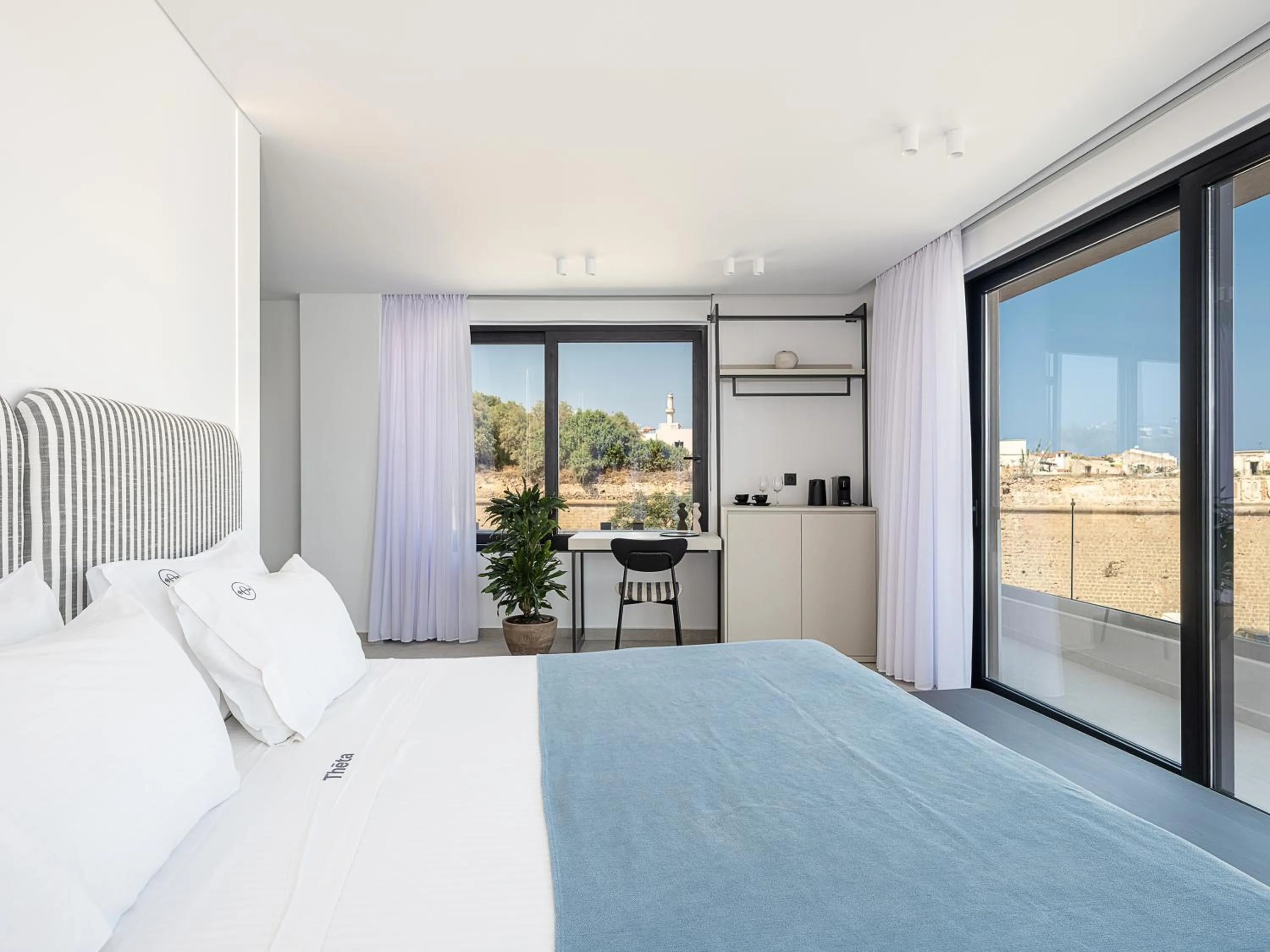 Bed in Theta Boutique Hotel